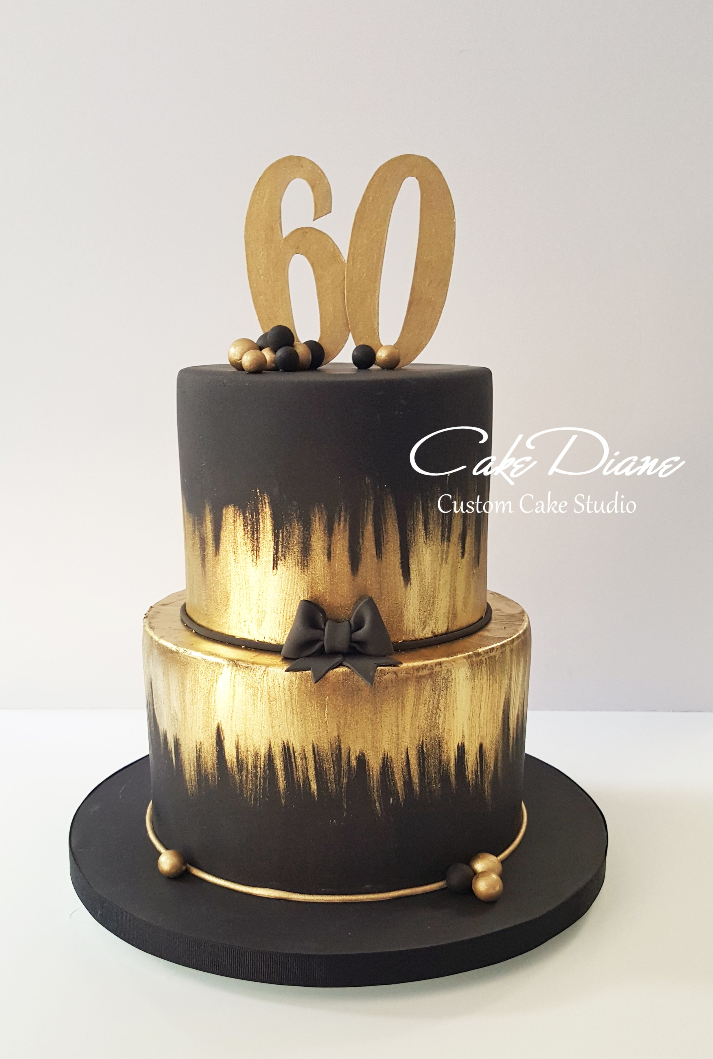 black and gold cake for a man s 60th birthday