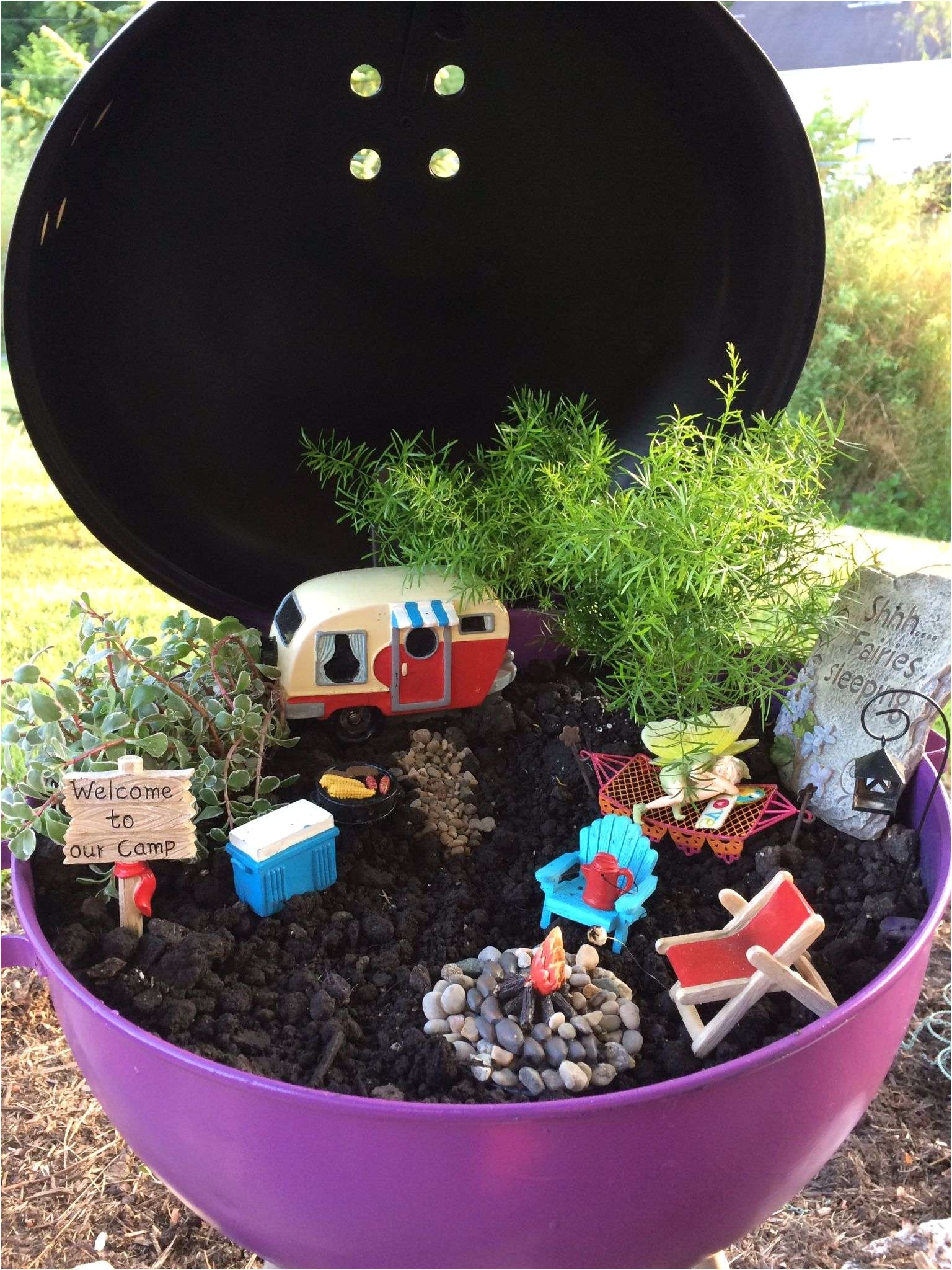 mickey mouse garden decor ideas painted an old charcoal grill to create the perfect place for a fairy campground plete