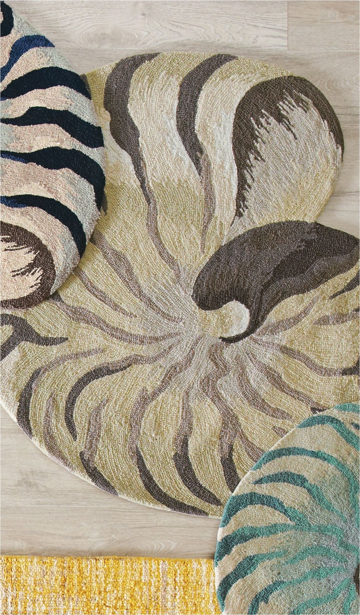 add a splash of seaside style with our spiraling shell shaped rug detailed yet