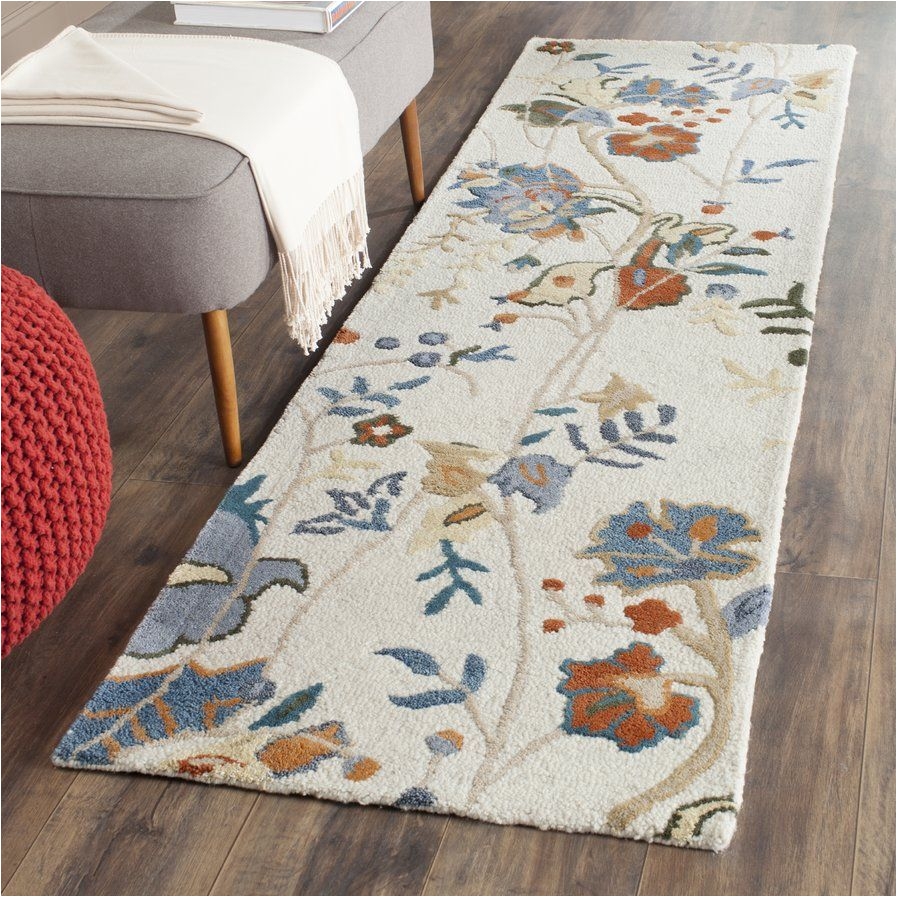 black raven hand tufted red blue area rug