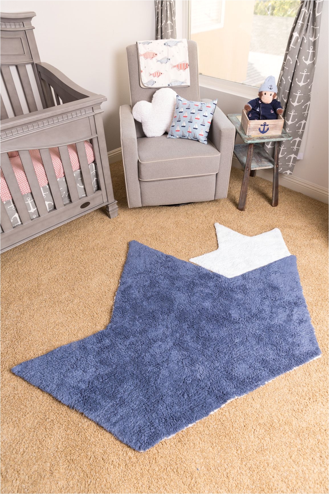 gray white and blue nautical nursery the boat shaped rug is the perfect touch