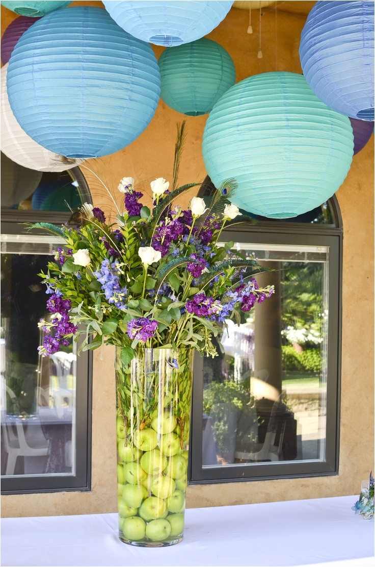 i love the idea of these paper lanterns in peacock colors if you do an outdoor