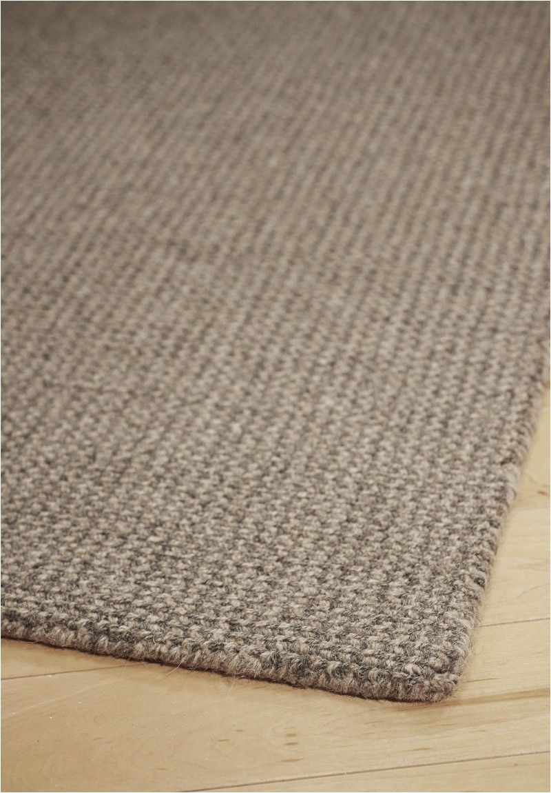 this soft and springy loom hooked wool rug brings casual comfort to any room
