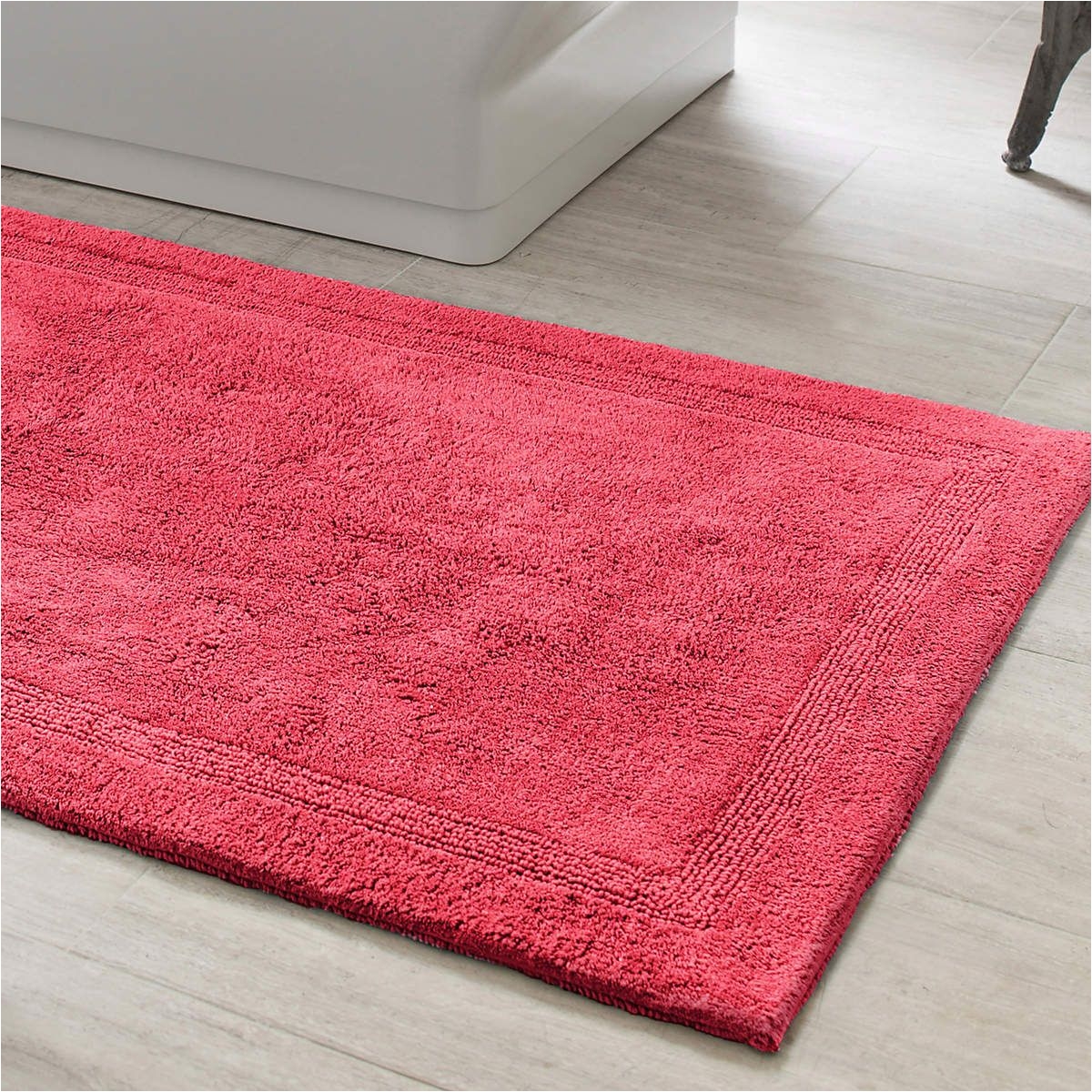treat your feet to the plushness of this thick soft cotton bath rug made to coordinate with our signature banded white red bath towels trio red shower