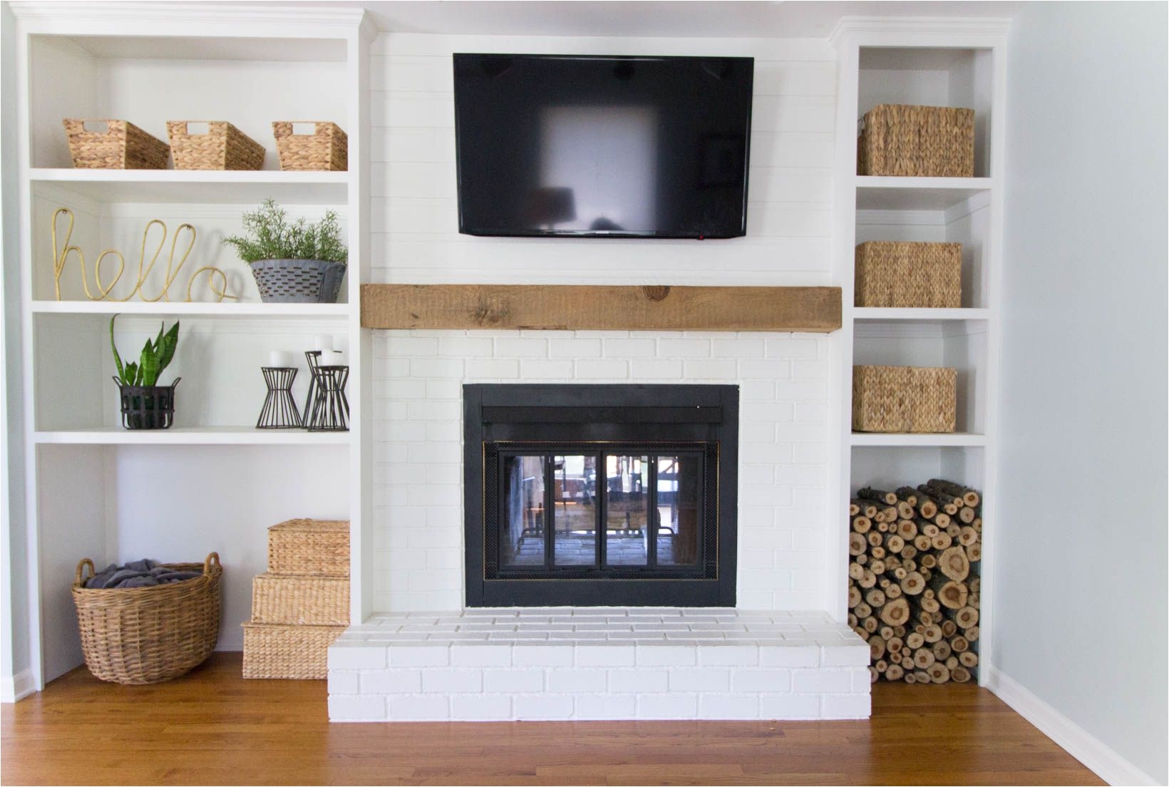 built in shelves around shallow depth brick fireplace