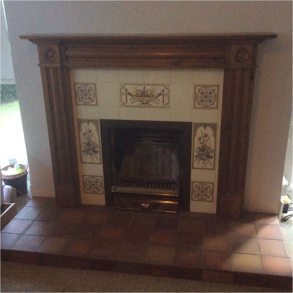 victorian look tiled fireplace complete with wood surround