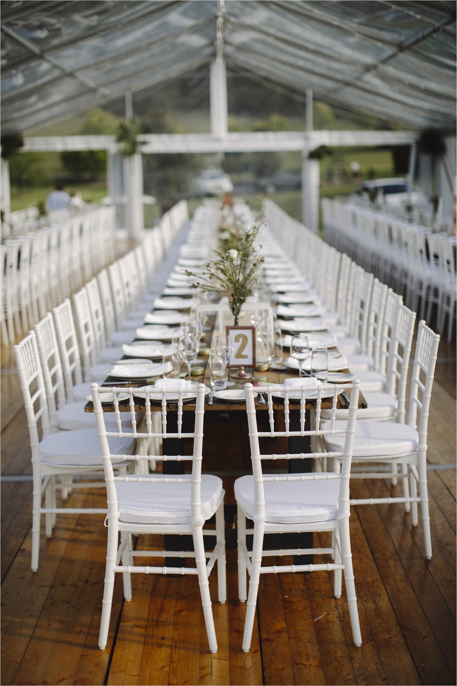 Renting Tables and Chairs San Diego White Tiffany Chairs Marquee Structure Integrated Timber Flooring