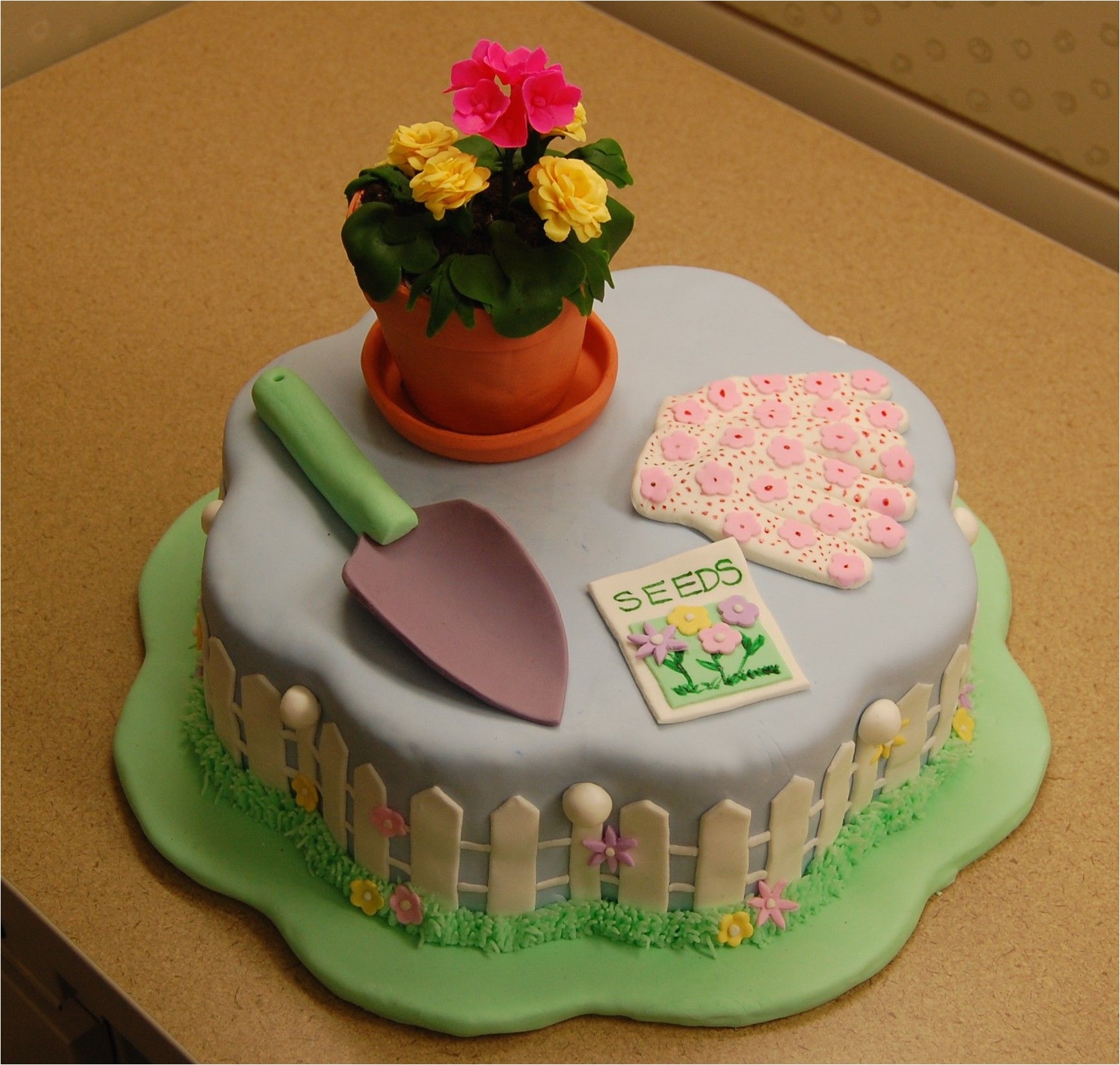 garden retirement cake made this retirement cake for a lady that likes gardening and her favorite flowers are geraniums and marigolds