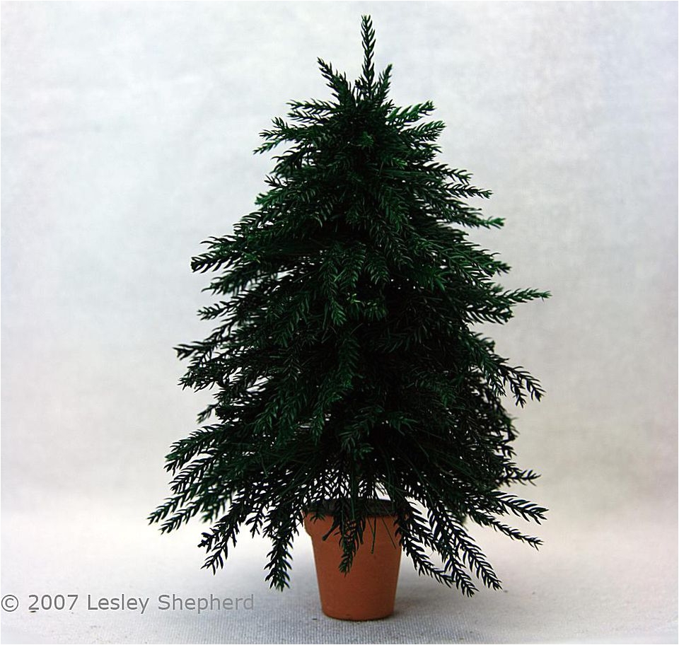 six inch high miniature christmas tree with realistic branches