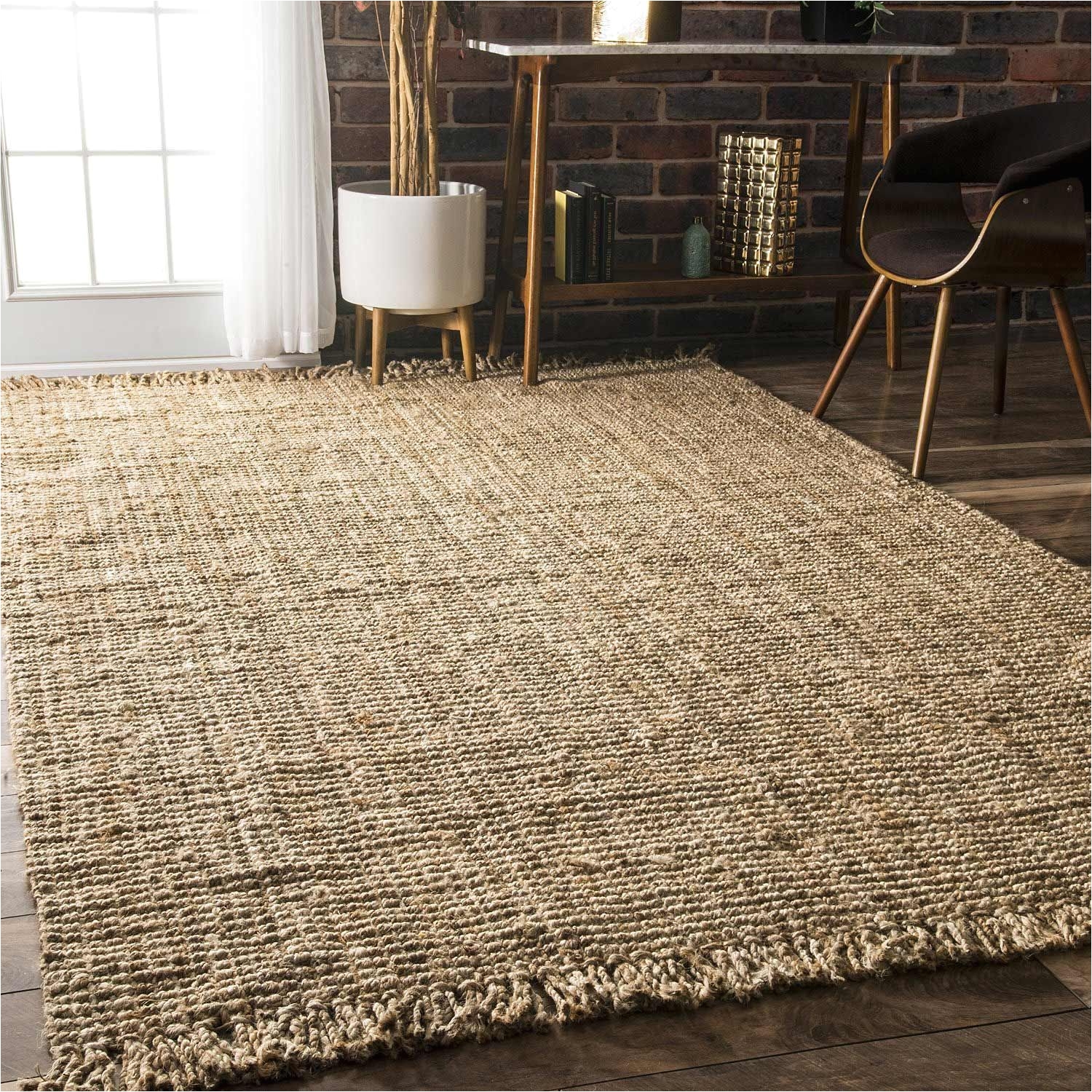 the durable fibers of the artisan crafted natural fiber chunky jute rug from nuloom make it ideal for placement in high traffic areas