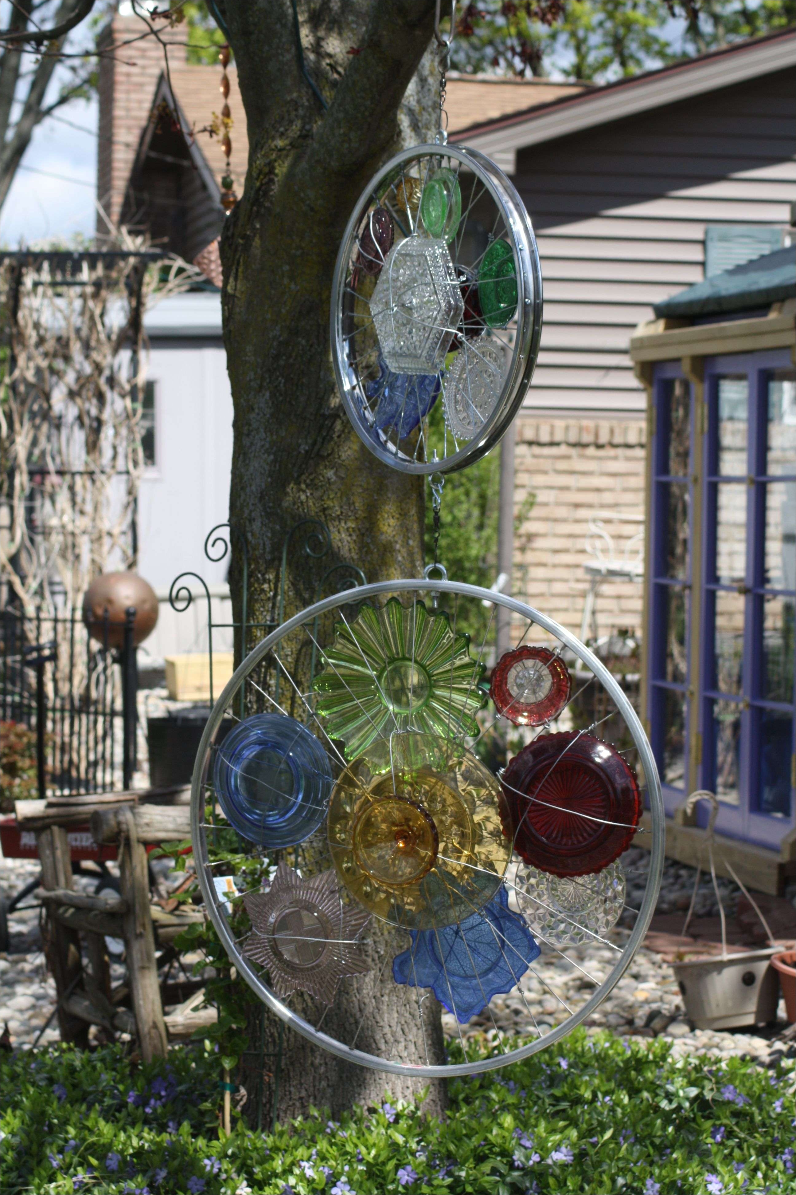 bicycle garden decor ideas 2 bicycle rims feature interesting colored glass pieces each will turn separatly in the wind yard