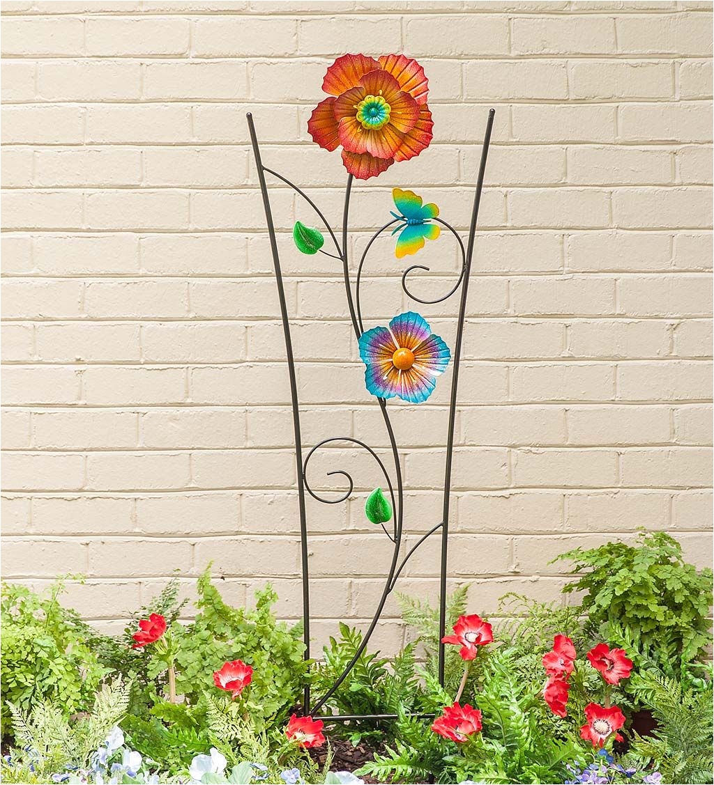 our spinning flower garden trellis does double duty as plant support and wind spinner garden art