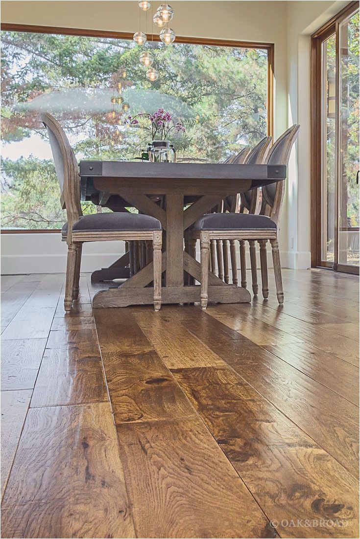 wide plank hand scraped hickory hardwood floor by oak and broad detail of heavy farm table complimenting rustic hand scraped floor discover more at