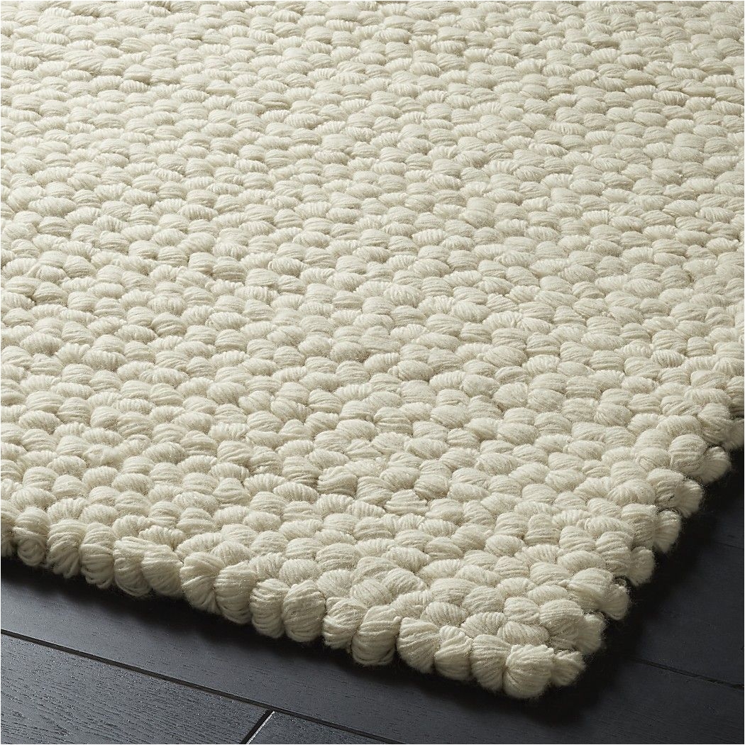 shop topknot natural wool rug narrow wool yarn is woven row by row secured with light grey and yellow yarn and pulled through to create large loops in
