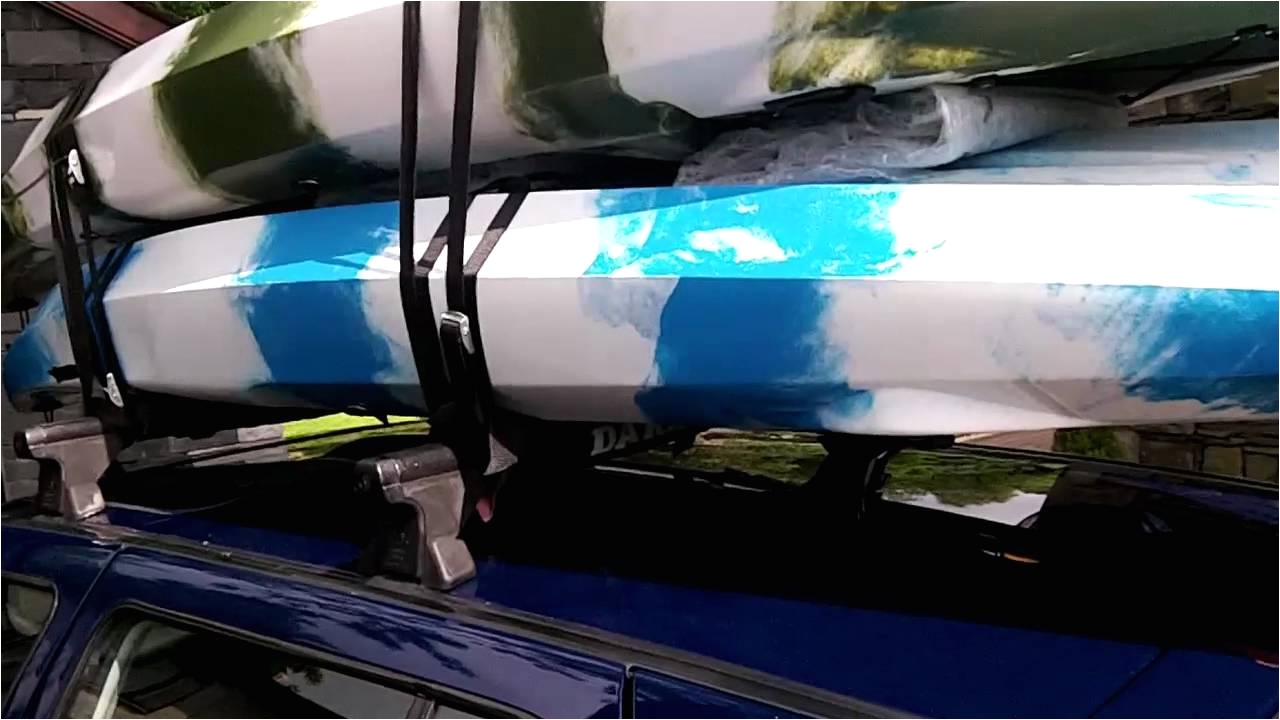 2 kayaks or canoes on a car roof rack