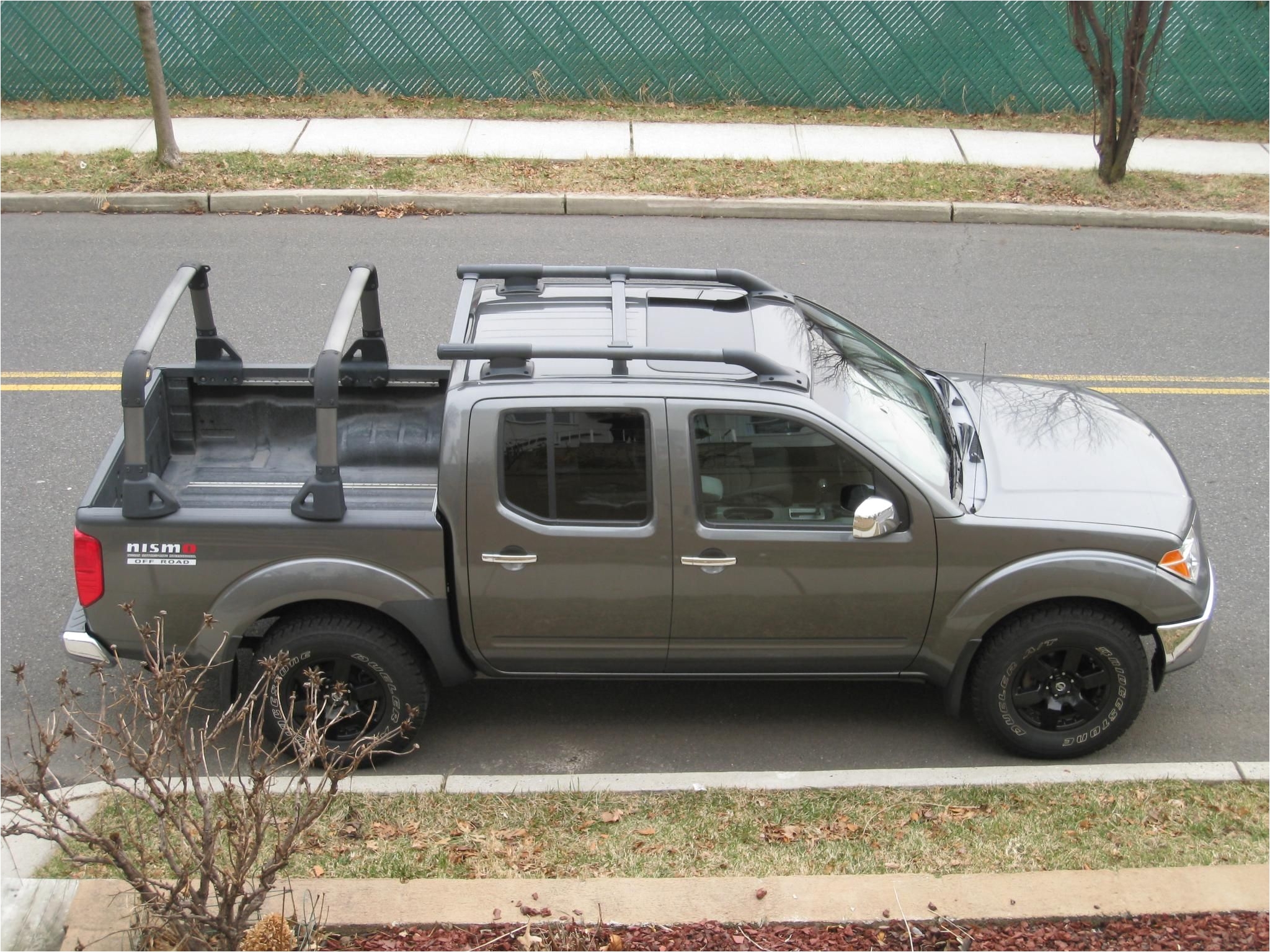 very good looking nissan frontier with bed rack and roof rack