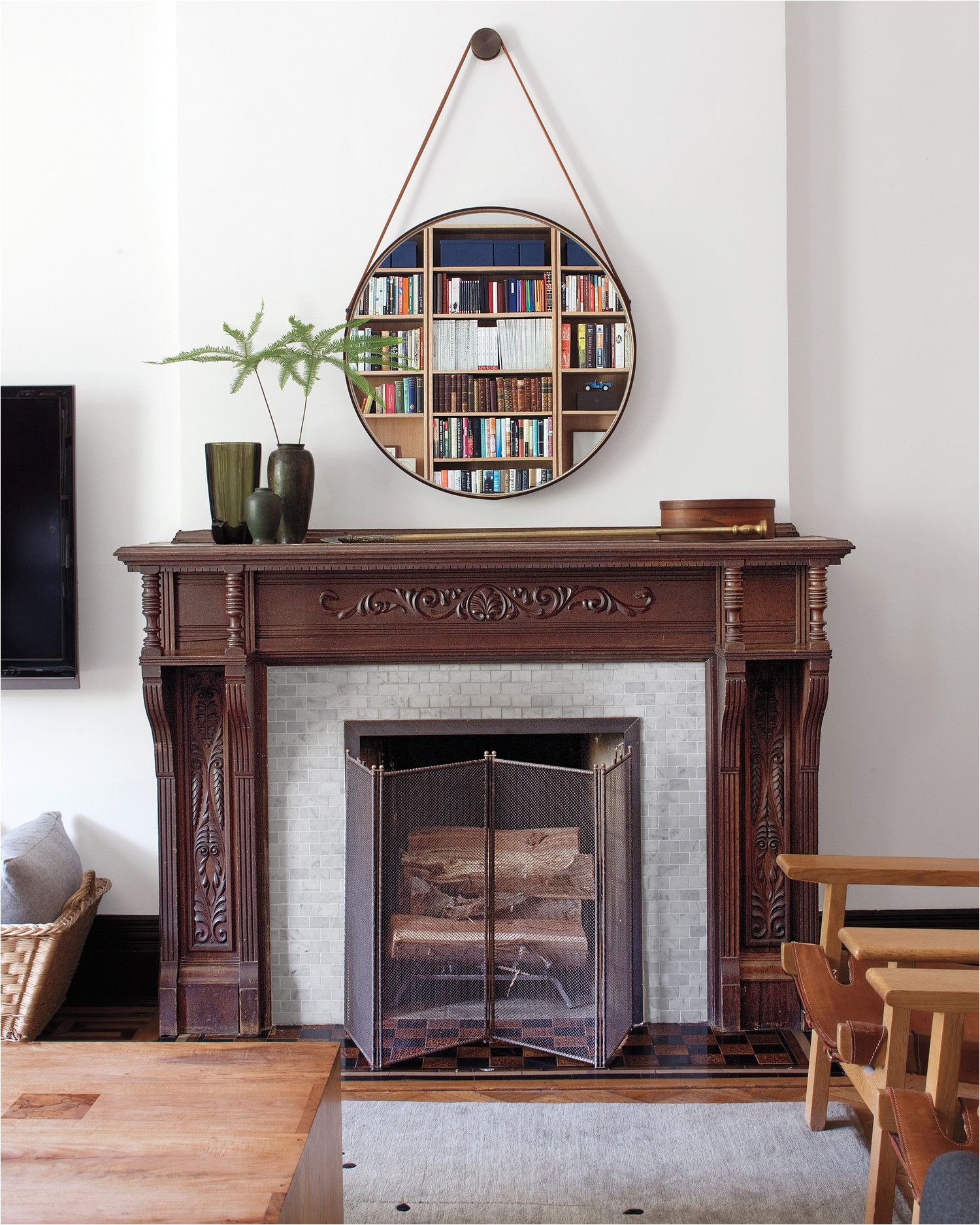 small brick period tiles made of marble were used to decorate this fireplace which is