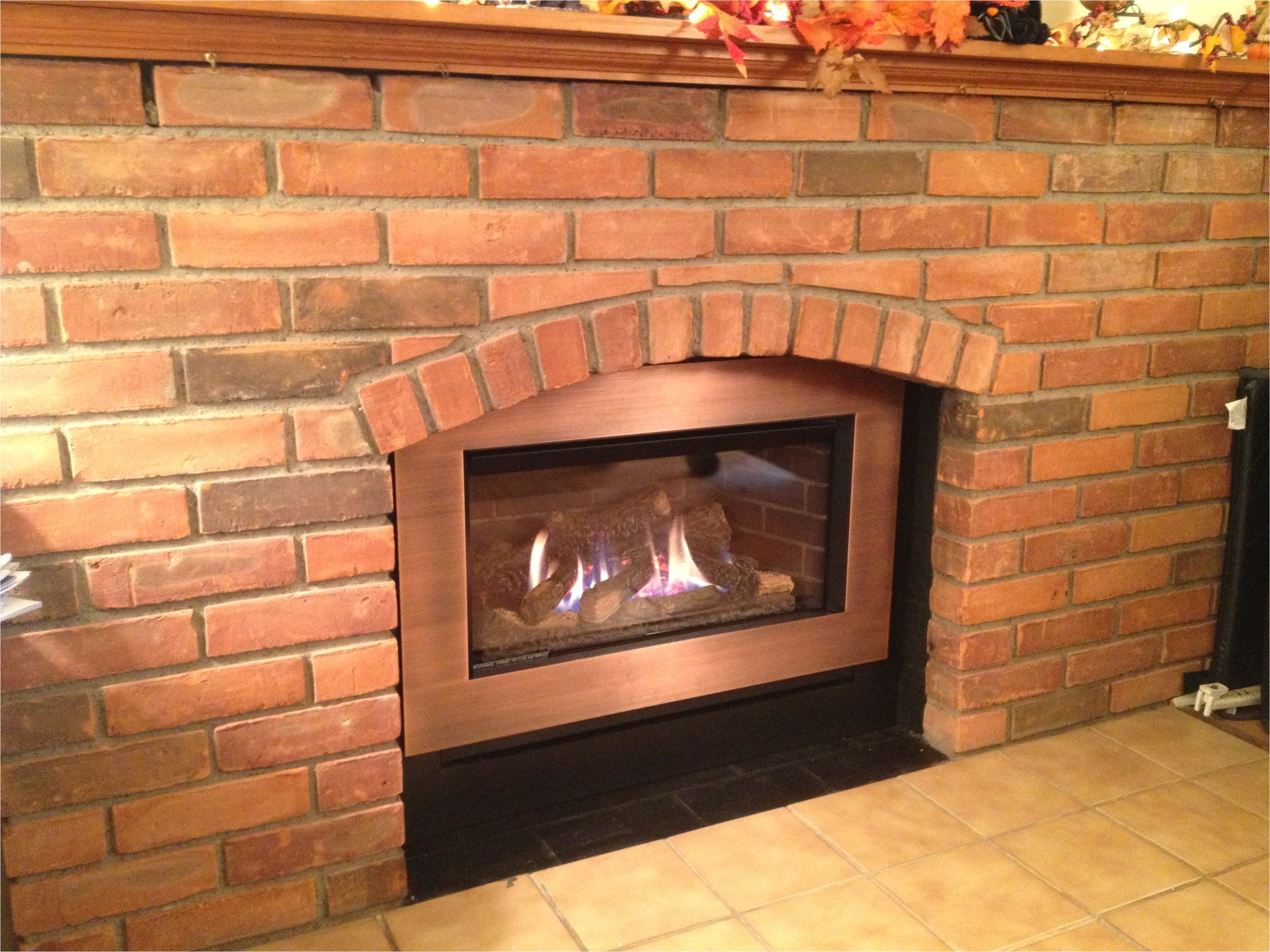 valor g3 785jln gas insert in arched brick fireplace