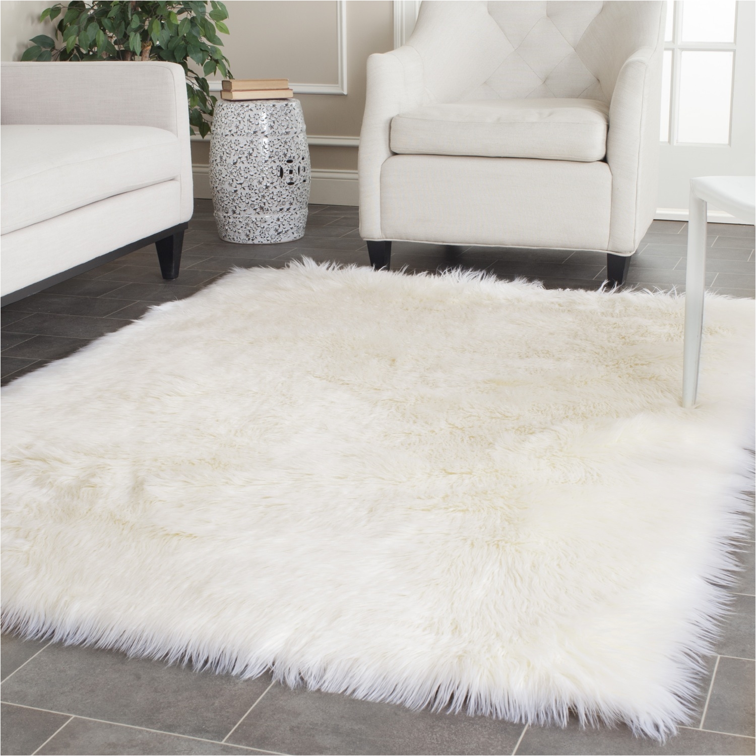 nice white sofa plus faux sheepskin rug on tile floor for living room decor