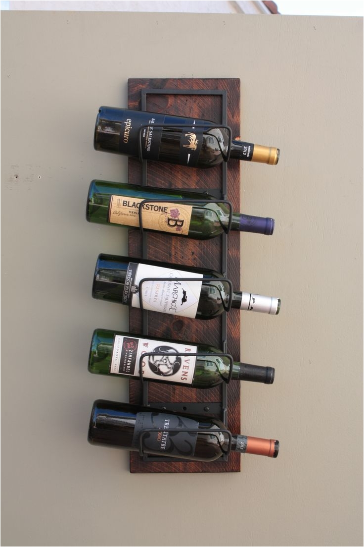 only our 5 bottle wine rack is created from carefully selected western cedar the wood is hand finished distressed stained a burned barn color and