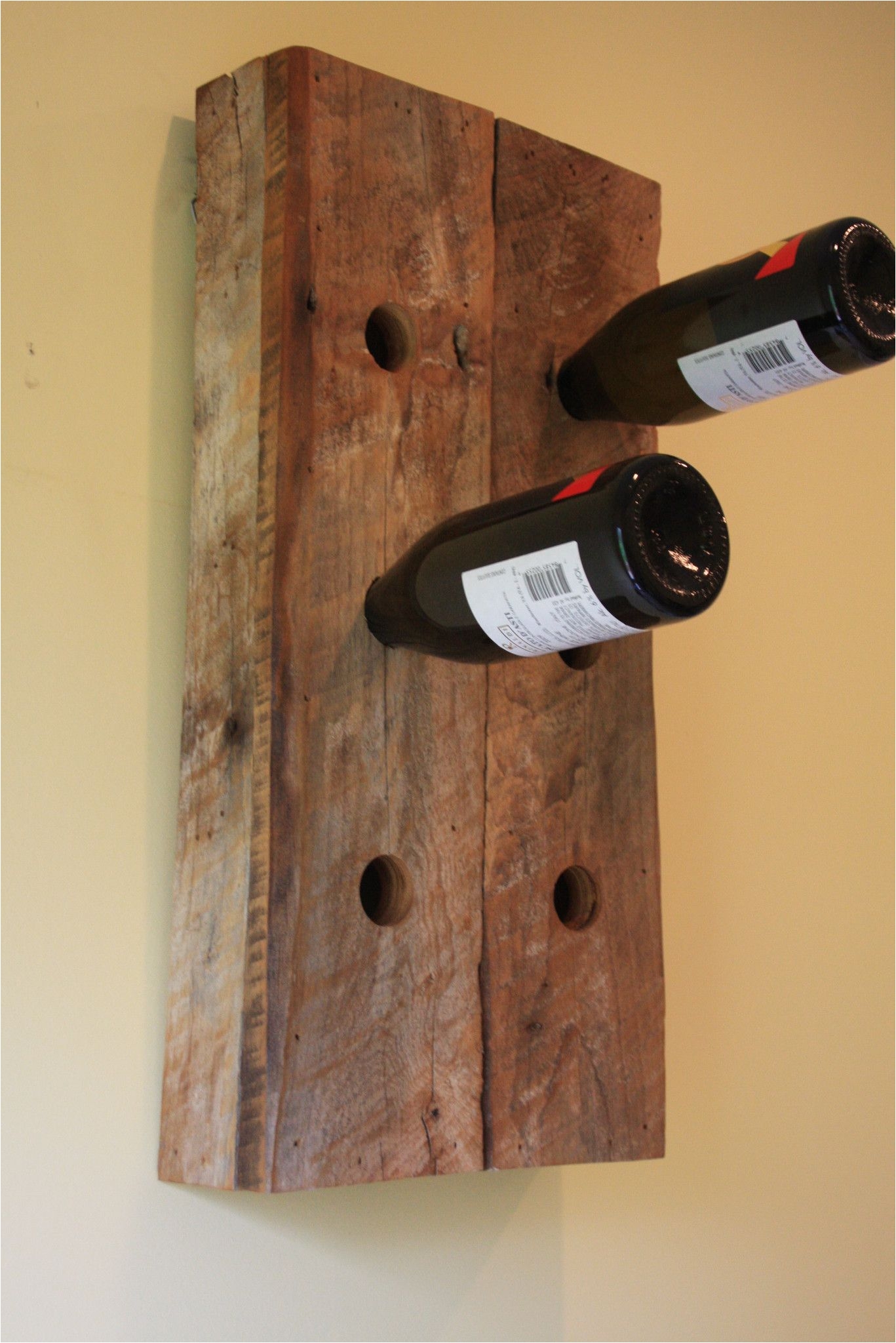 this is a 6 bottle wine holder made from a barn built in 1897 in denver