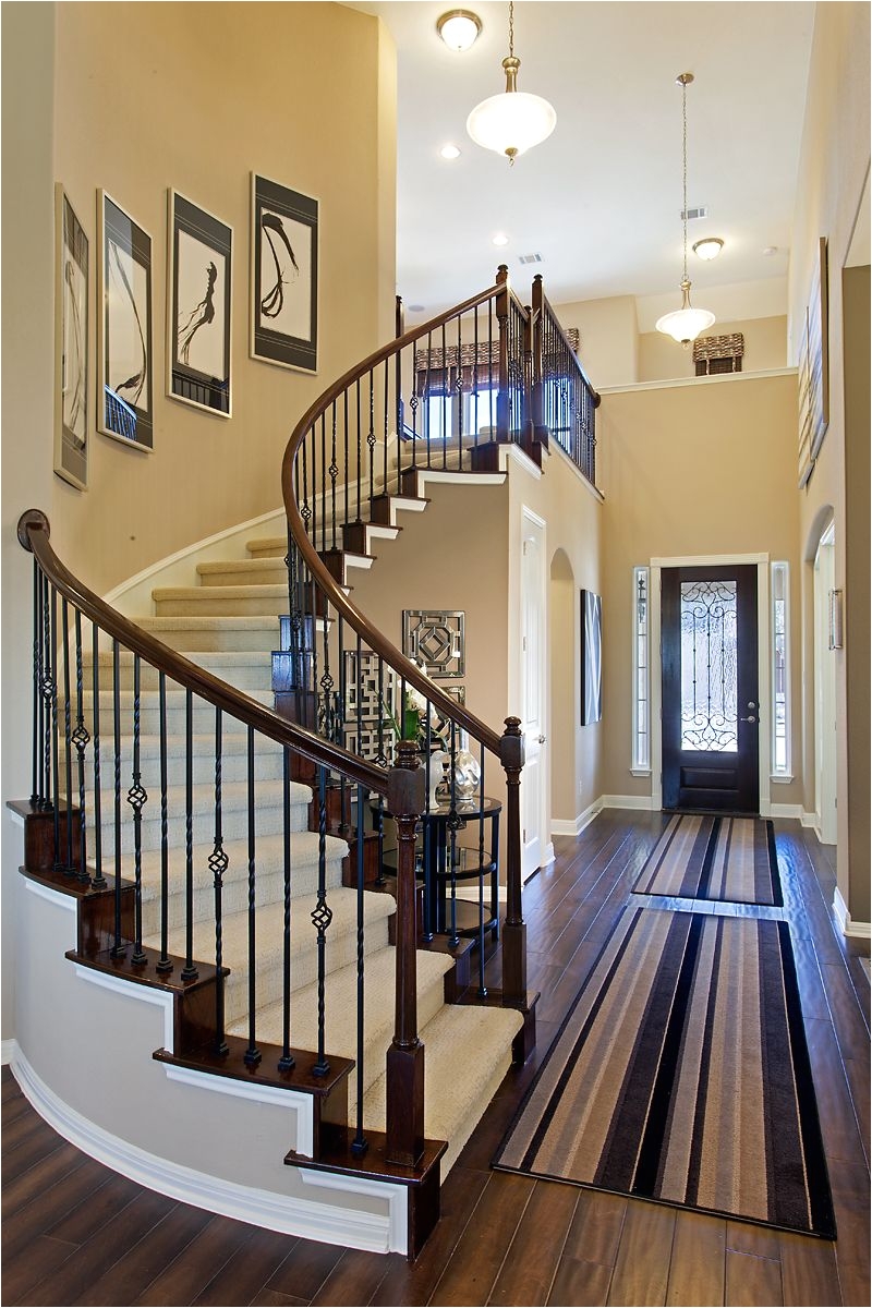 curved staircase with wrought iron spindles more