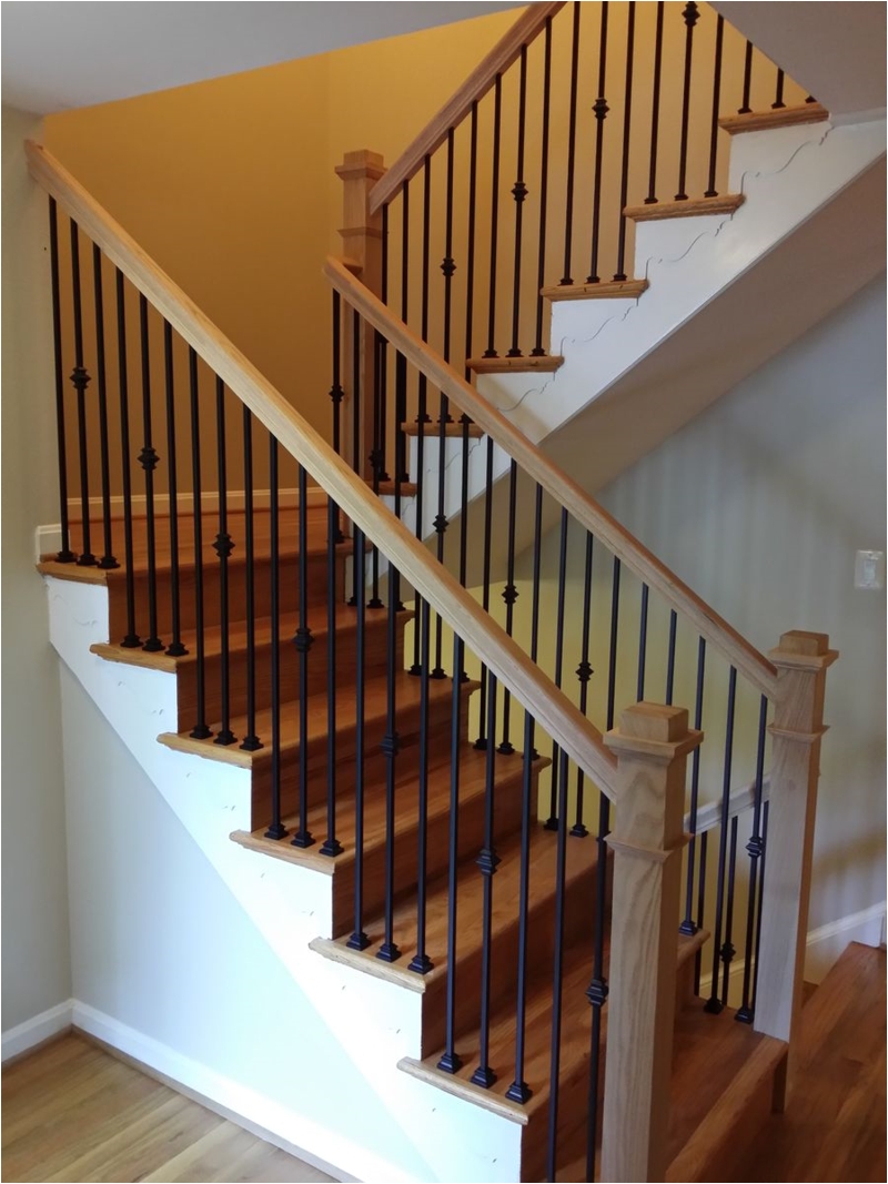stair railings with black wrought iron balusters and oak boxed type newel posts