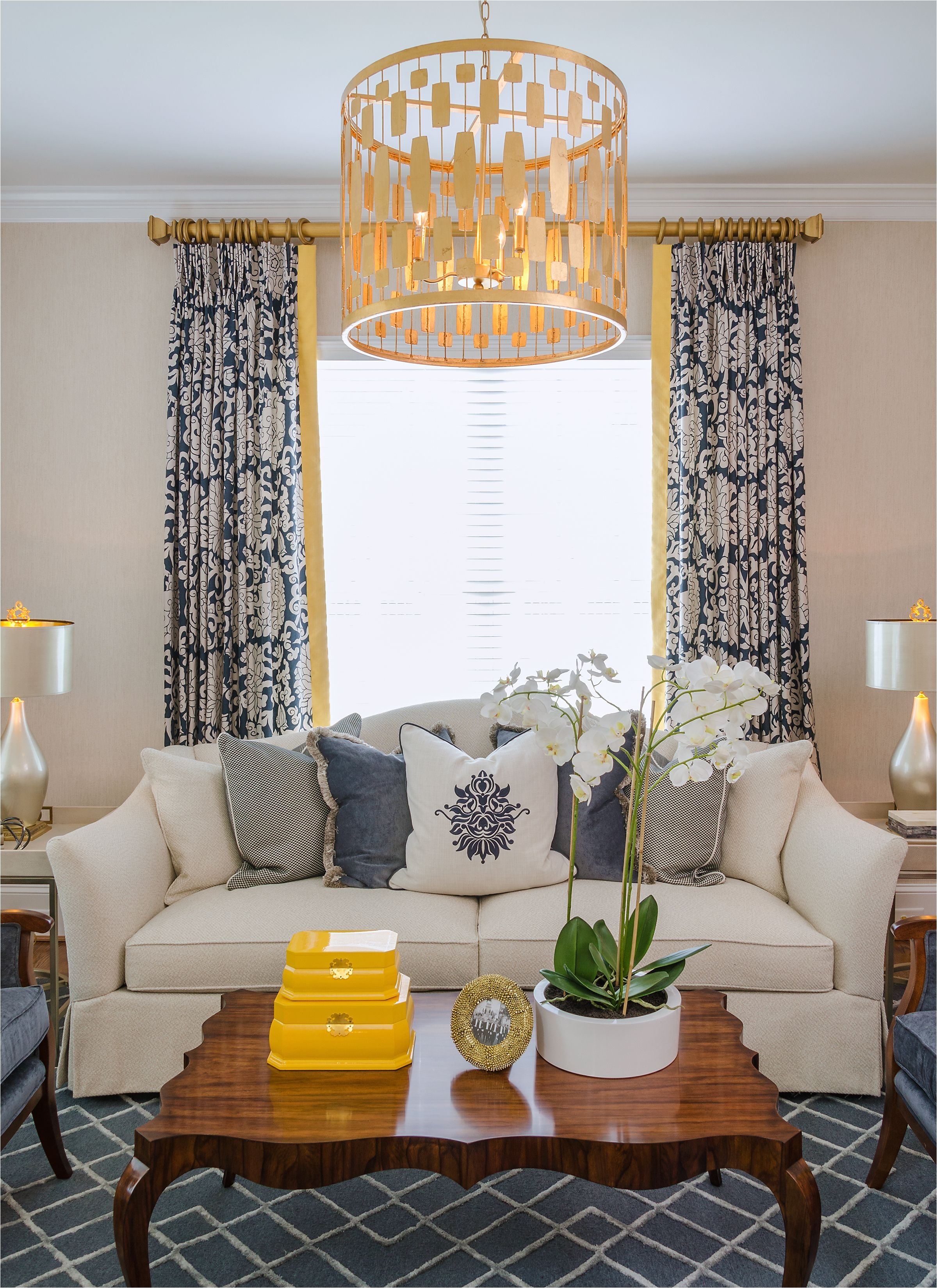 beautiful yellow pop of color living room gold drum pendant grey and cream