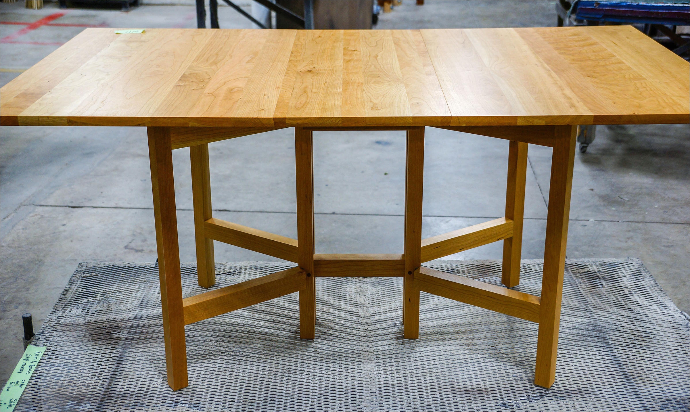 a finished gate leg cherry table ready to ship