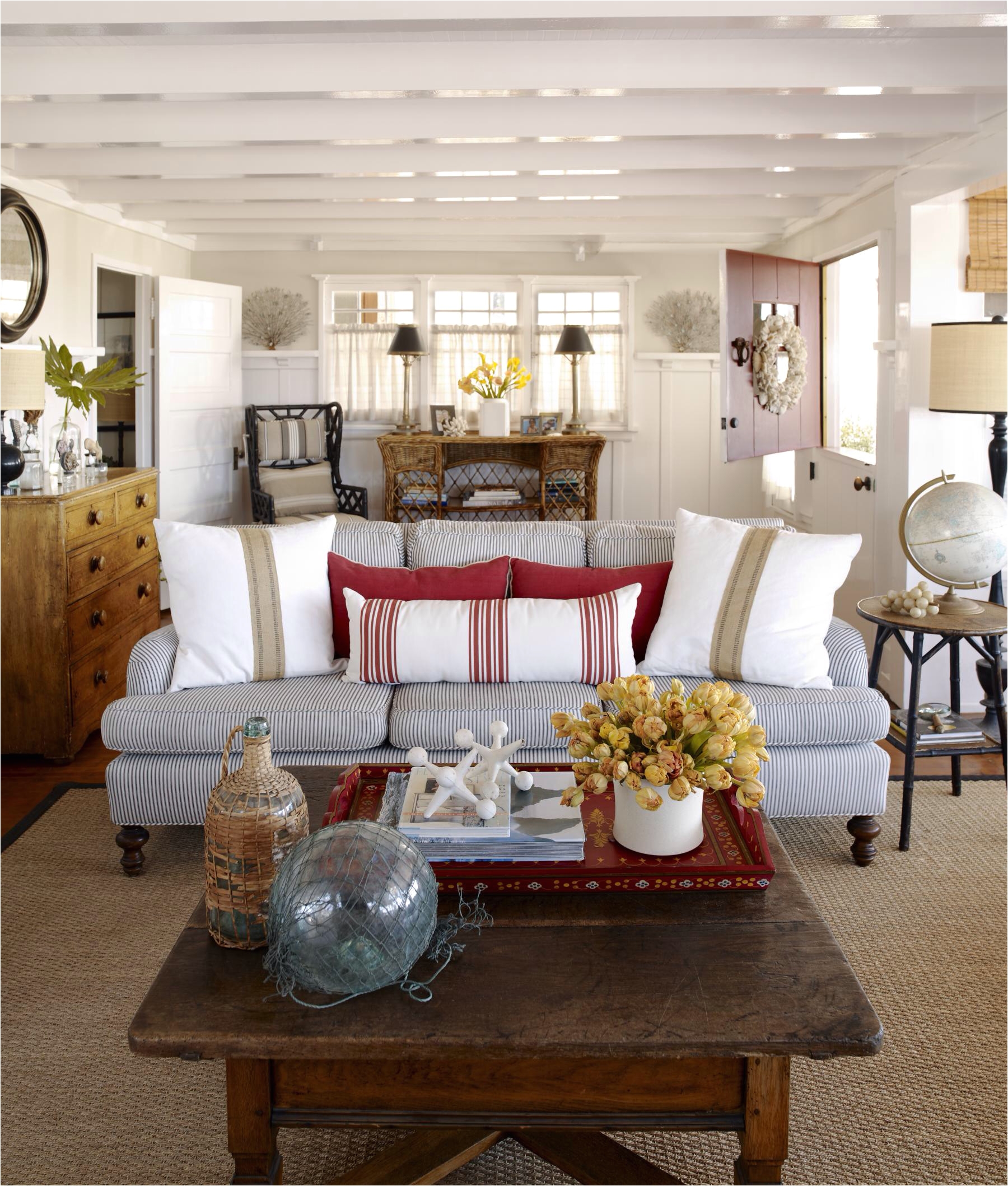 shabby chic white coastal slipcover furniture and white washed woods create these lovely and