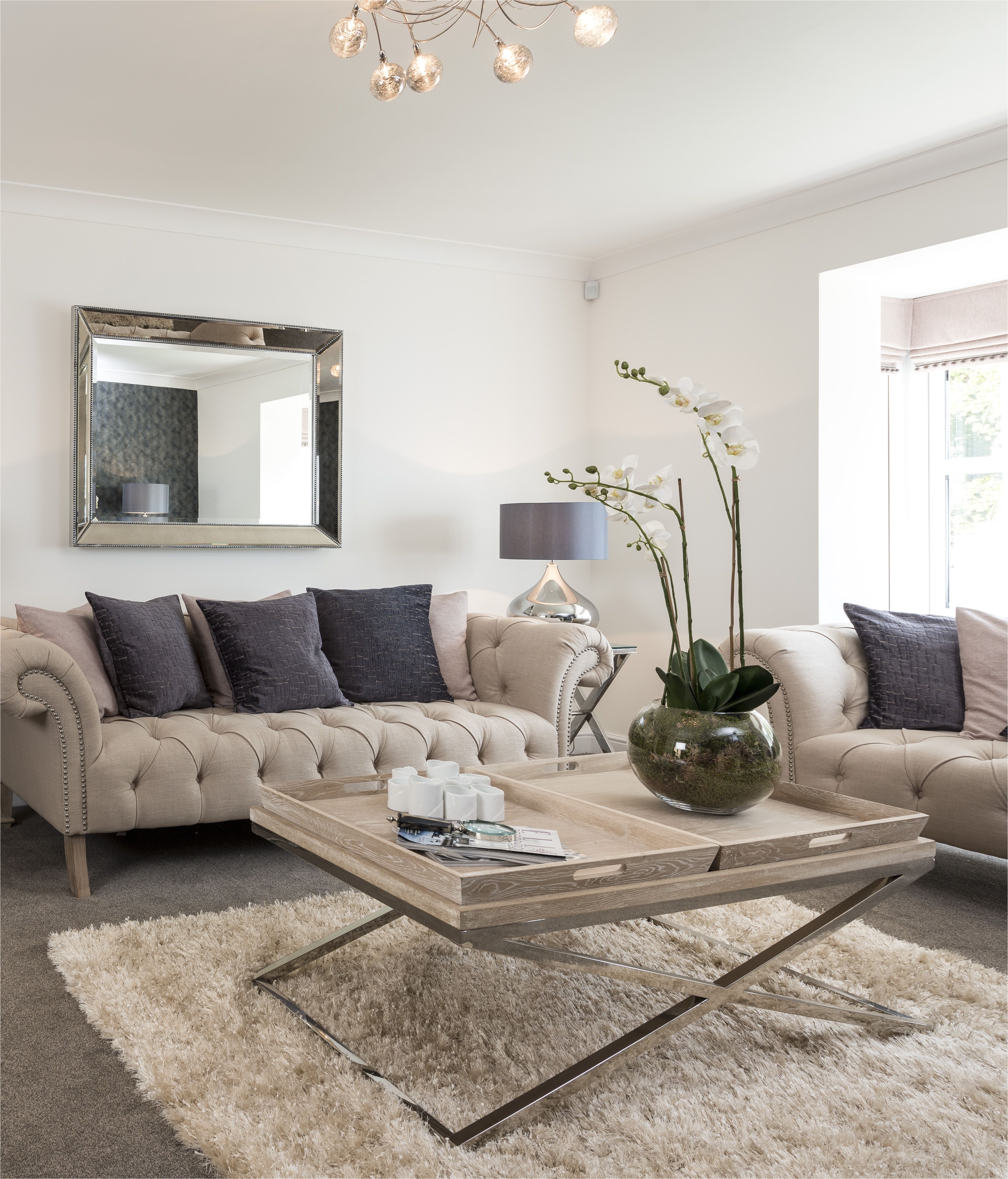 interior stylist suzanne webster chose a classic cream chesterfield sofa for the lounge complemented with a cream studded armchair and balanced by the soft