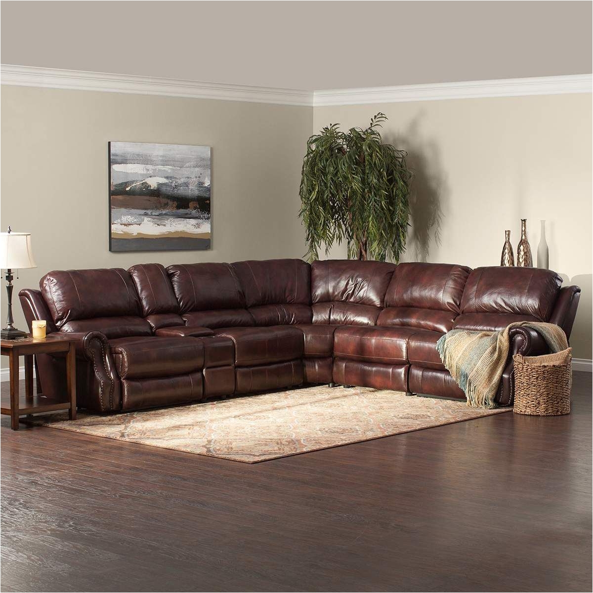 2899 99 jeromes the triton is a luxurious brown reclining sectional with buttery soft top grain leather seating traditional scoop rolled arms are