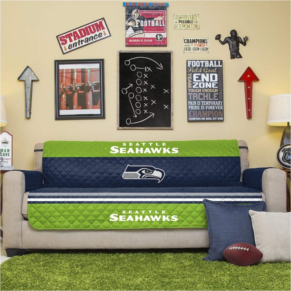 amazon com pegasus home fashions nfl seattle seahawks sofa couch reversible furniture protector with elastic straps 75 inches by 110 inches home