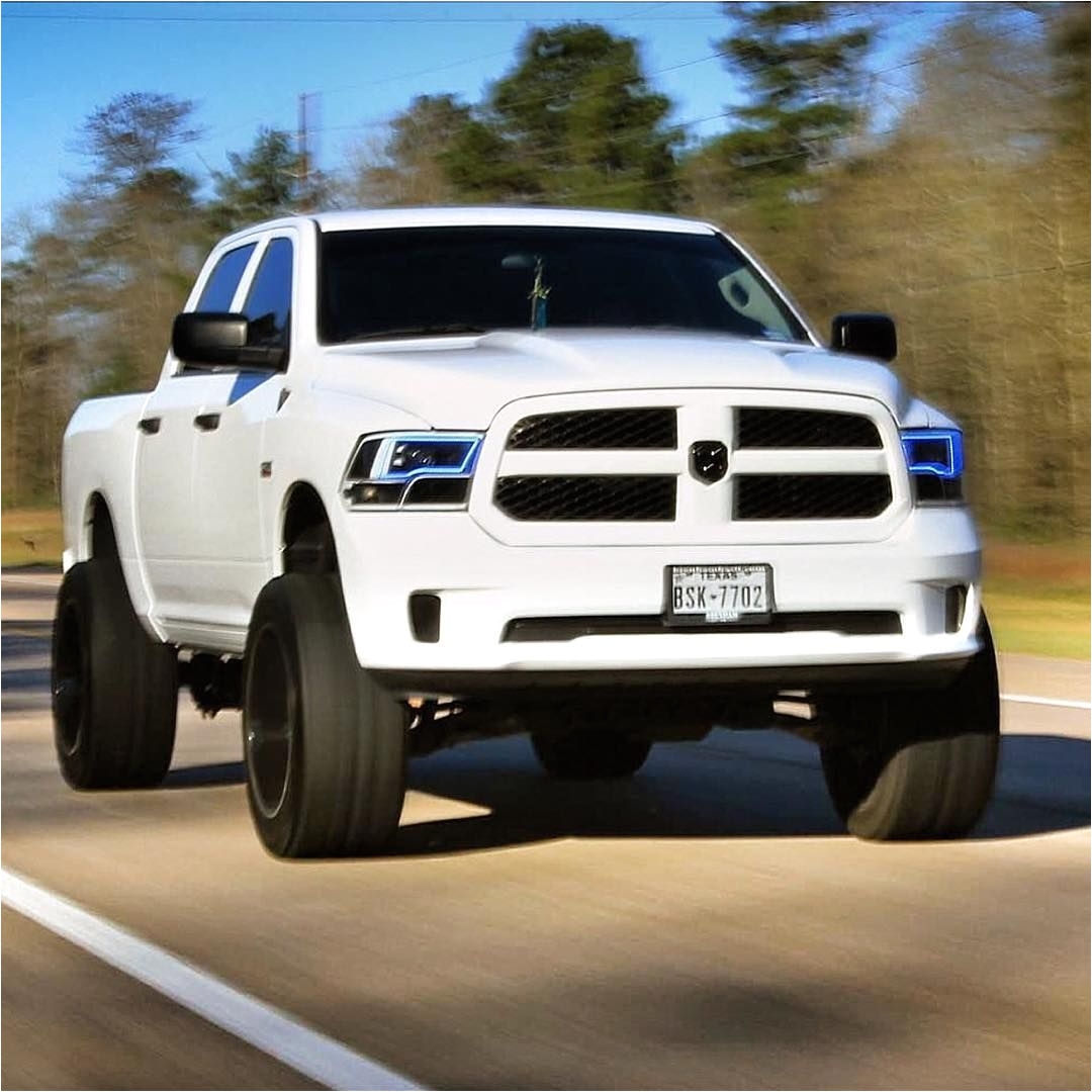 2013 ram 1500 hemi 7 inch lift 22x12 fuels 35 inch nittos custom retrofitted headlights painted to match and color morph oracle lights recon smoked