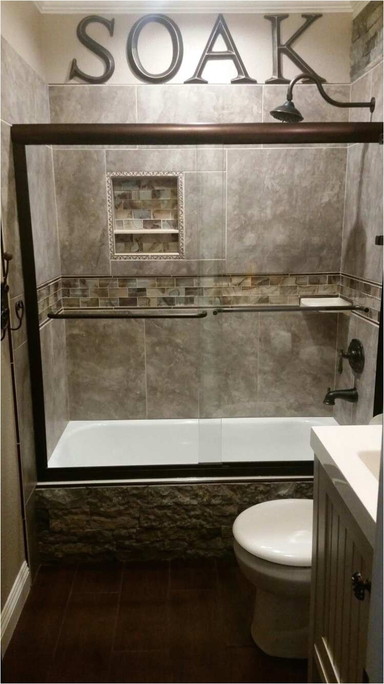 diy rustic small guest bathroom cented with airstone faux stone on the side of the tub