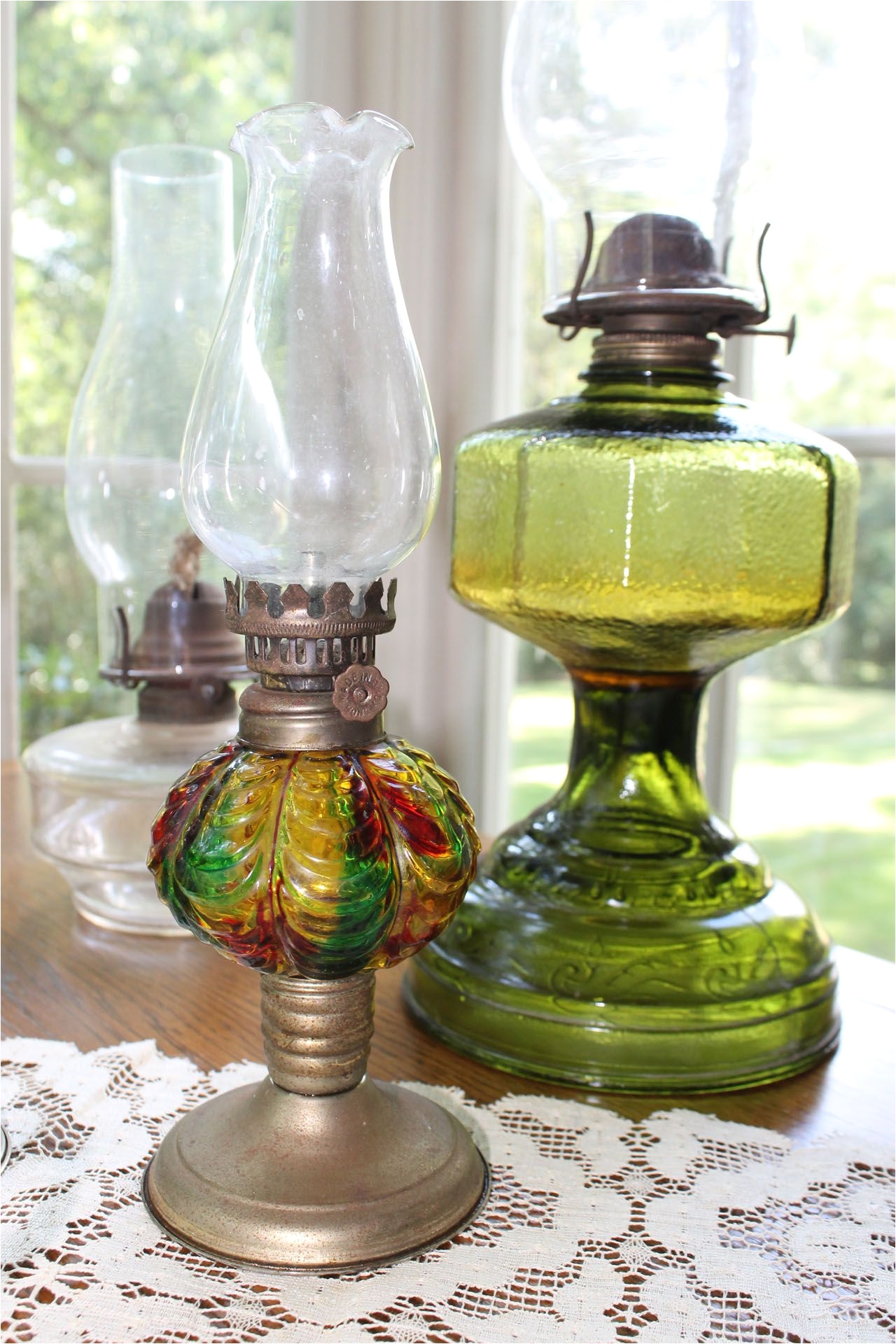 prepper we have oil lamps with colored glass and clear nice addition to table centerpieces i saw on your board with the black lanterns in center