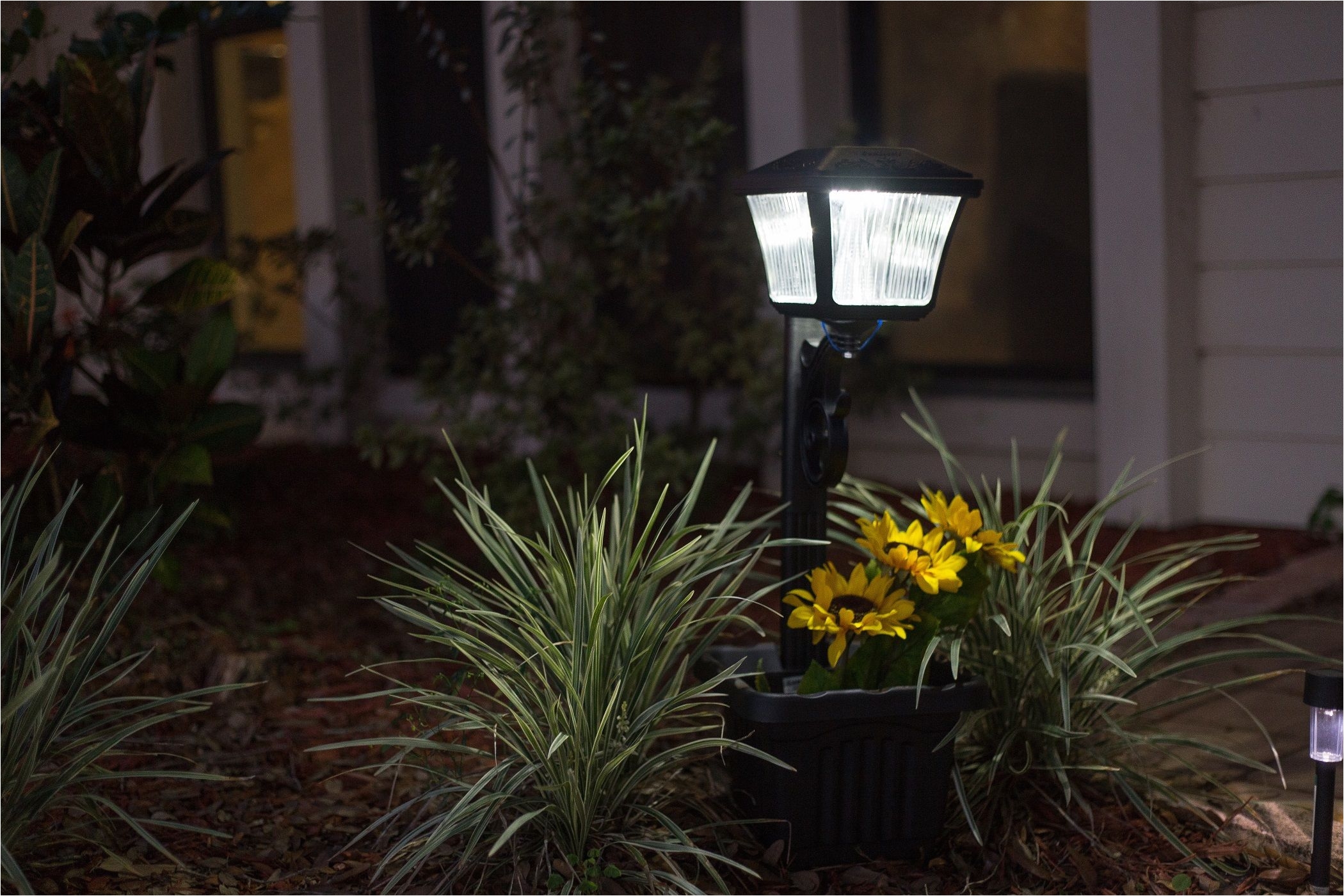 this diy and eco friendly solar powered path light is extremely simple to install and comes with attachable plantern to showcase any flowers and foliage