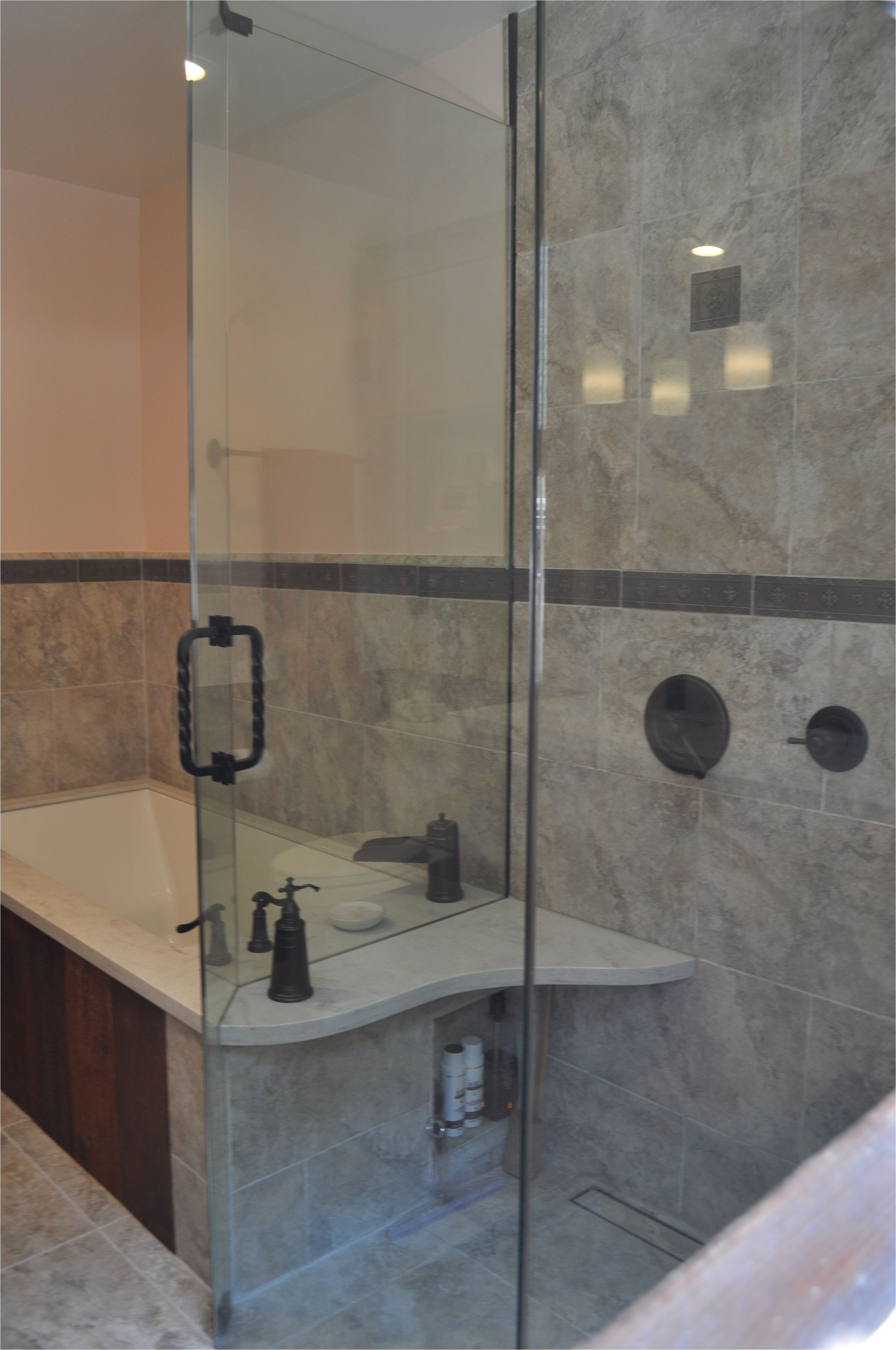 after tub counter was extended to create a seating bench for the shower small