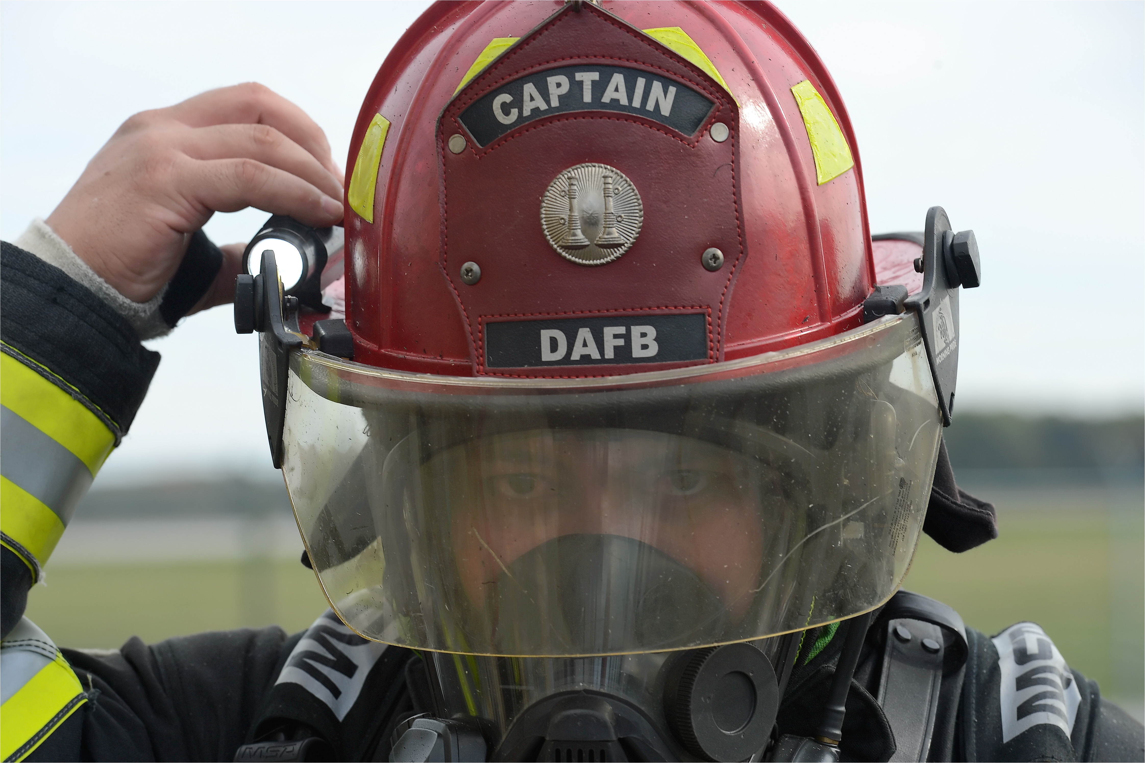 tech sgt ryan atoigue adjusts a light attached to his helmet while participating in