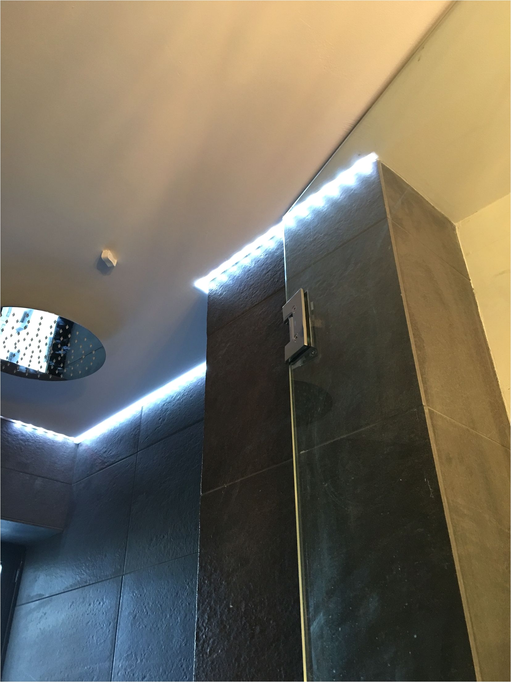 philips hue led strip in aluminum track with frosted lens this lighting is placed in a shower ceiling