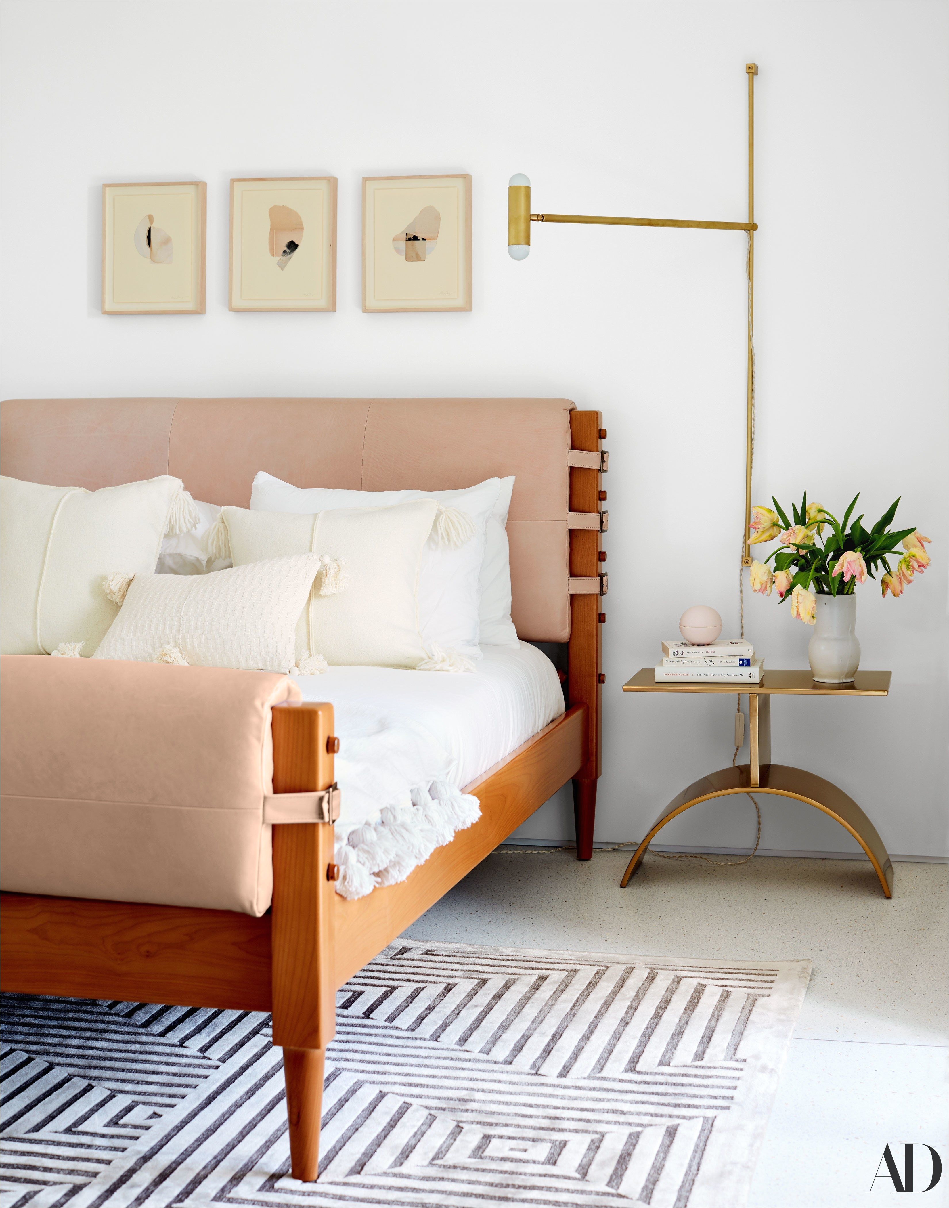 beautiful blush headboard leather wrapped around wood modern brass nightstand in bedroom
