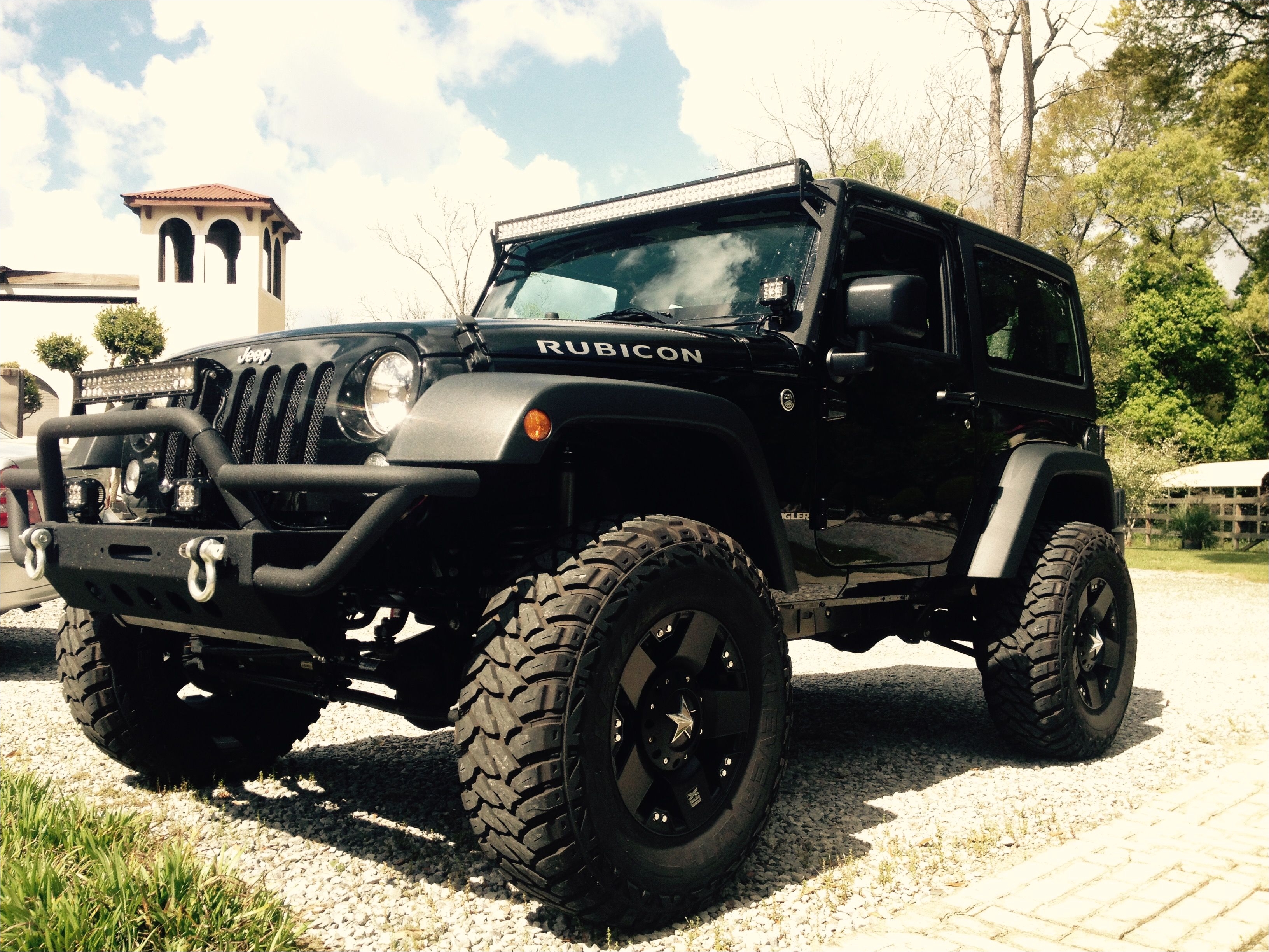 black jeep wrangler 2 door 4 inch lift 35 inch tires black rockstar rims 50 inch led light bar 24 inch led light bar led pod lights rubicon