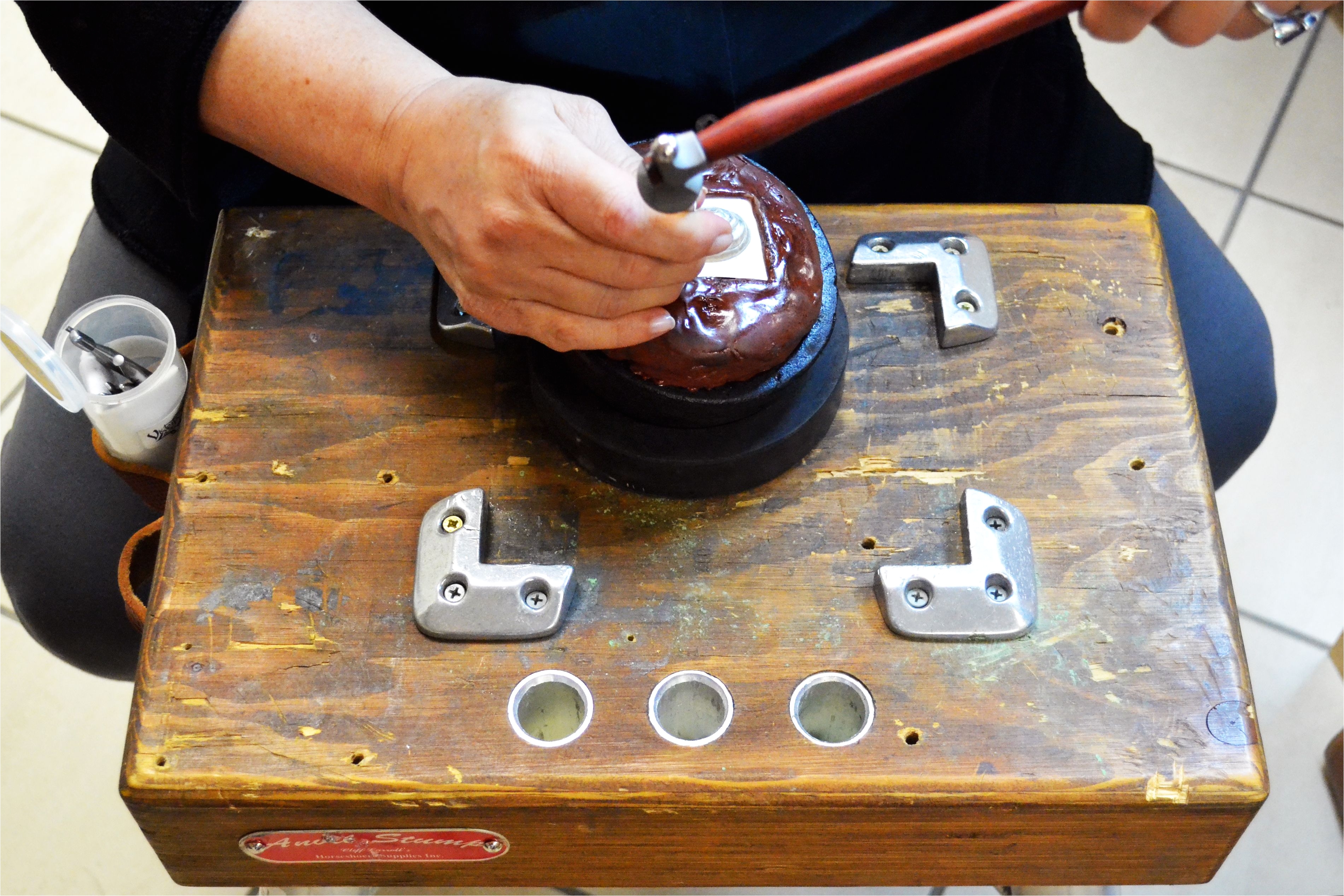 repousse jewelry making in action on the jewelers bench
