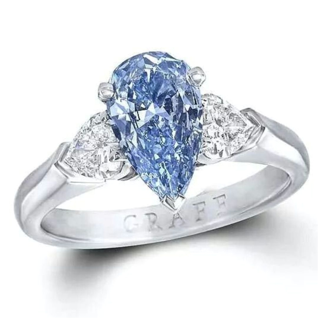graff 1 04ct internally flawless blue diamond engagement ring flanked by two pear shaped white