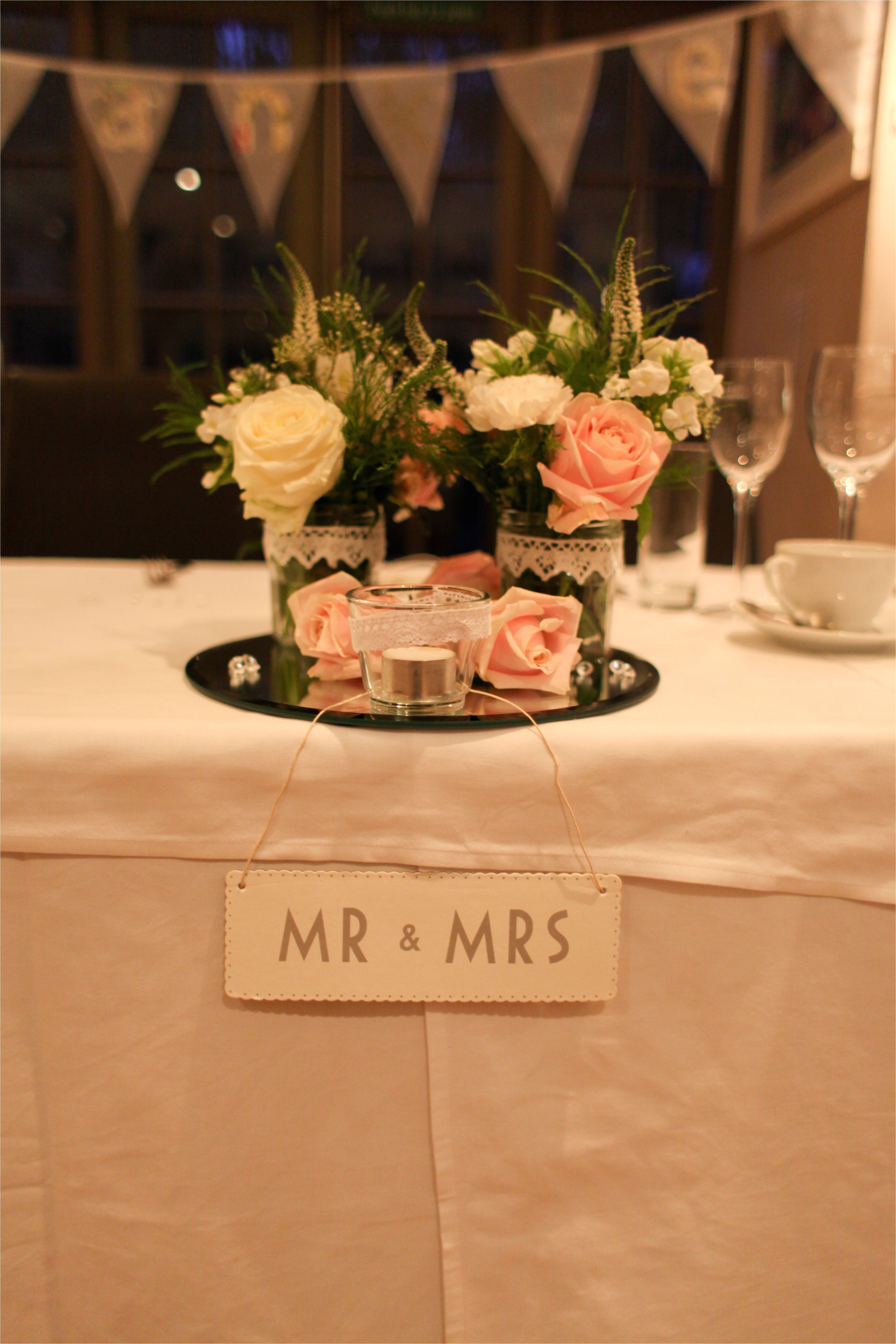 table decorations top table mr and mrs sign light pink and cream flowers