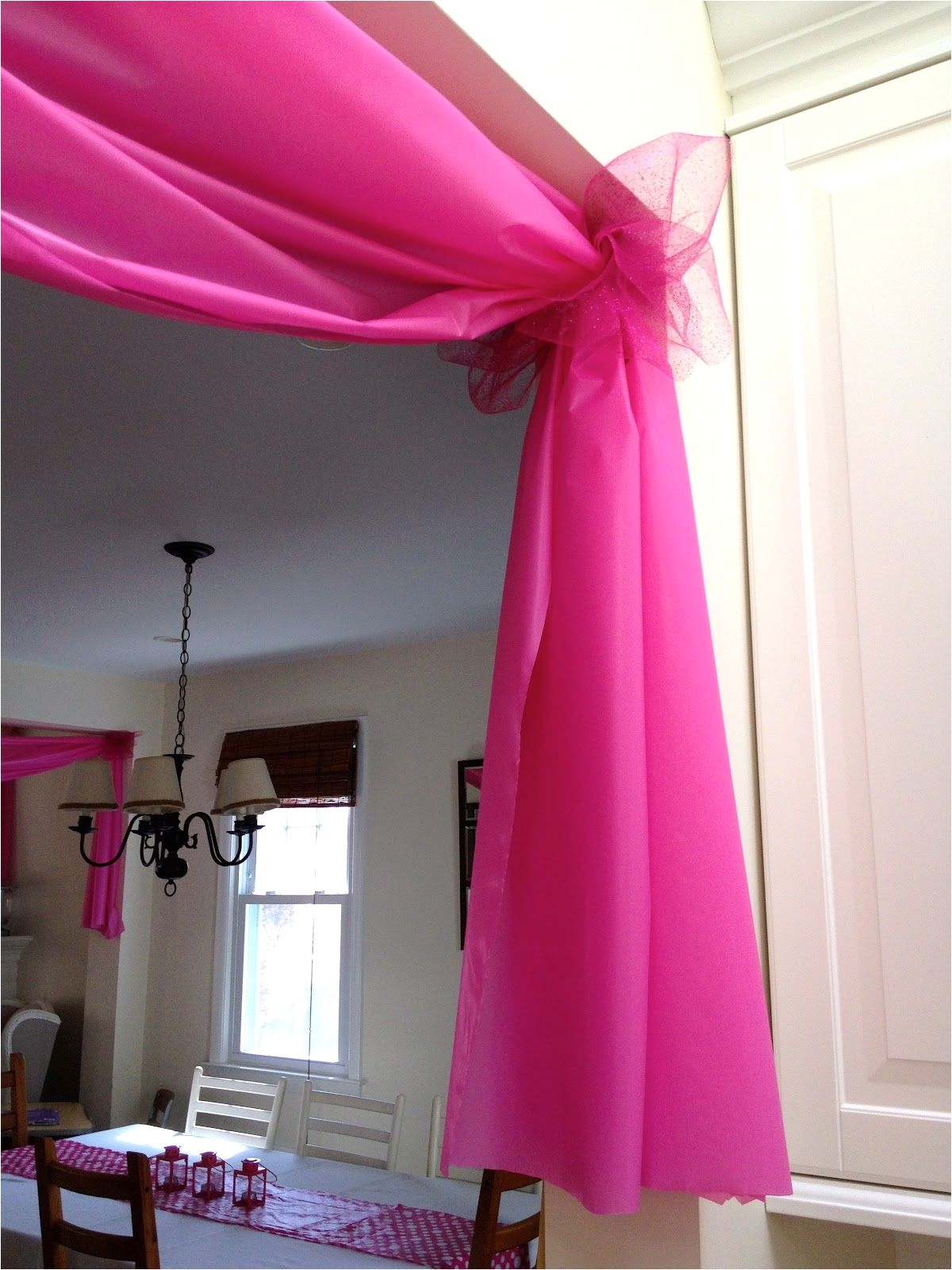 use 1 plastic tablecloths to decorate doorways and windows for parties etc wonderful idea how cute