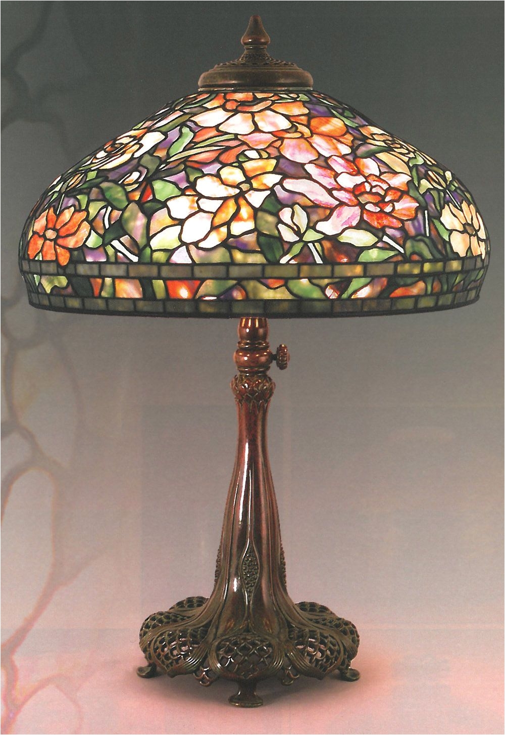 authentic tiffany lamp in the peony pattern on a very nice adjustable height base