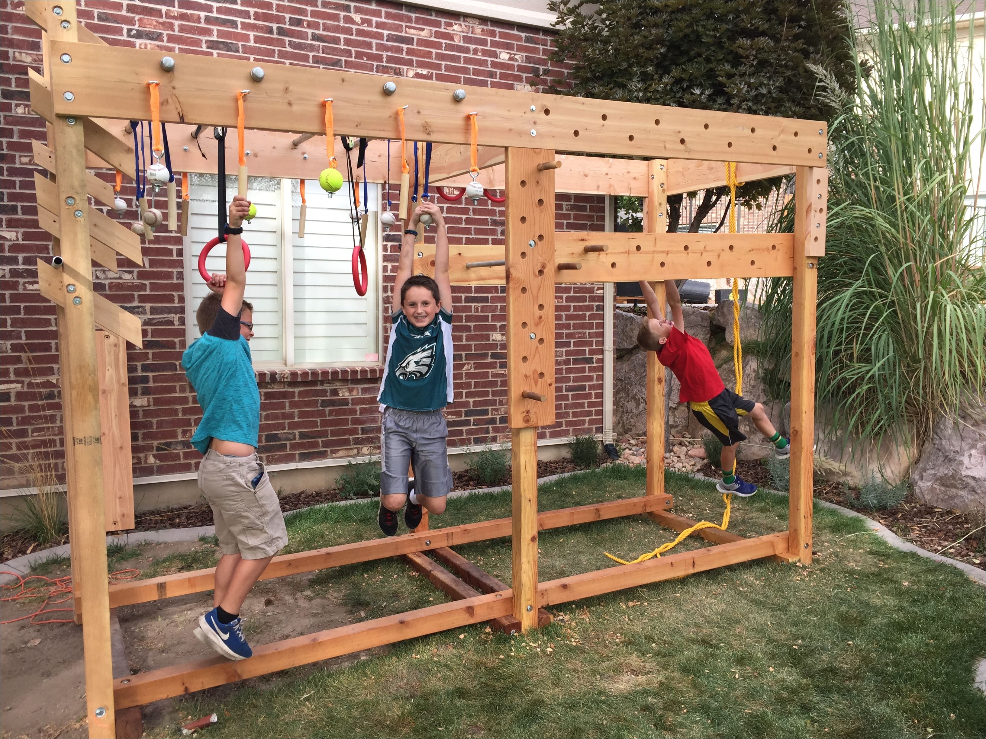 ninja warrior training course i made for the kids and myself in our back yard it has a peg board circuit ring toss peg circuit monkey bars