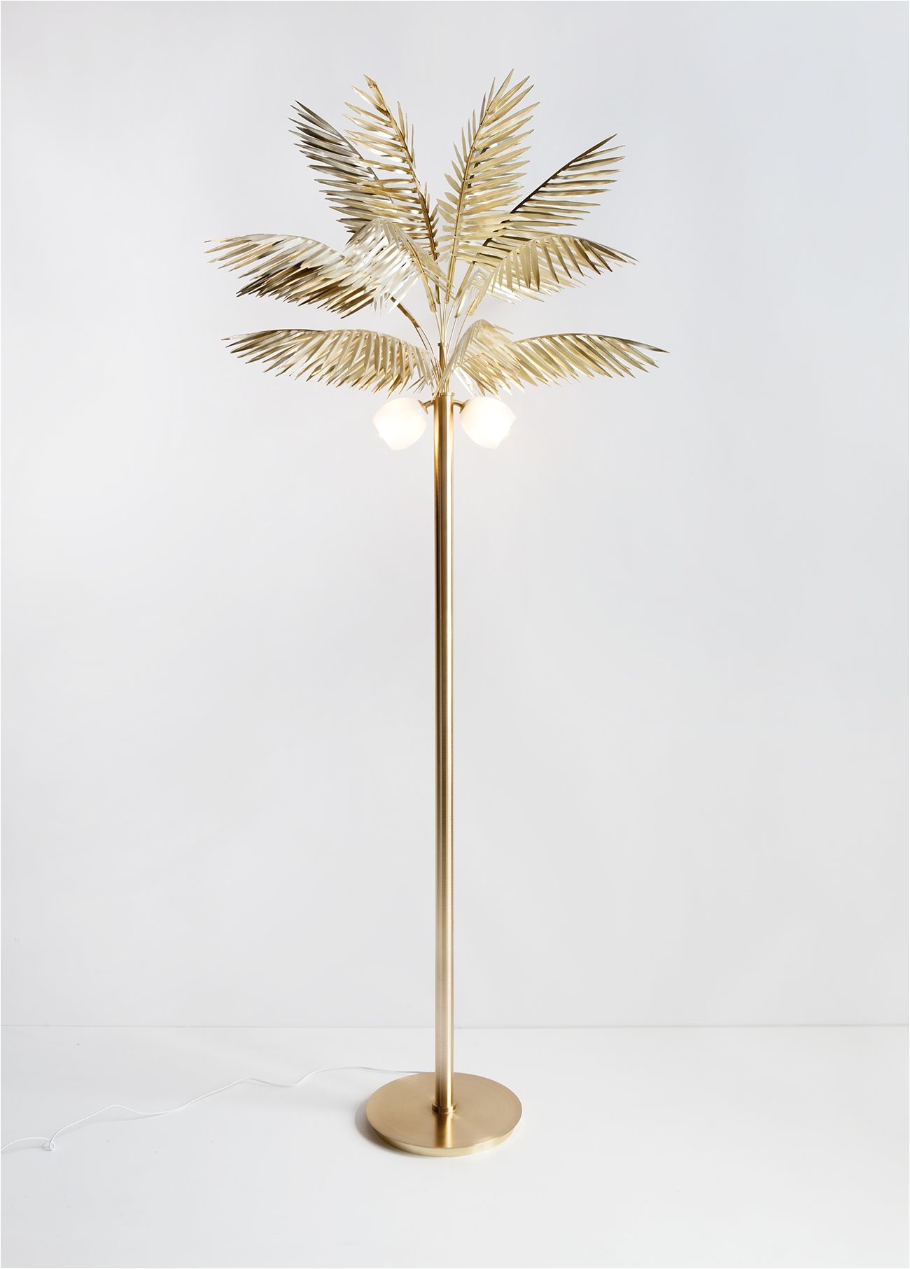 syrette lew of moving mountainss palmyra palm tree lamp via sightunseen