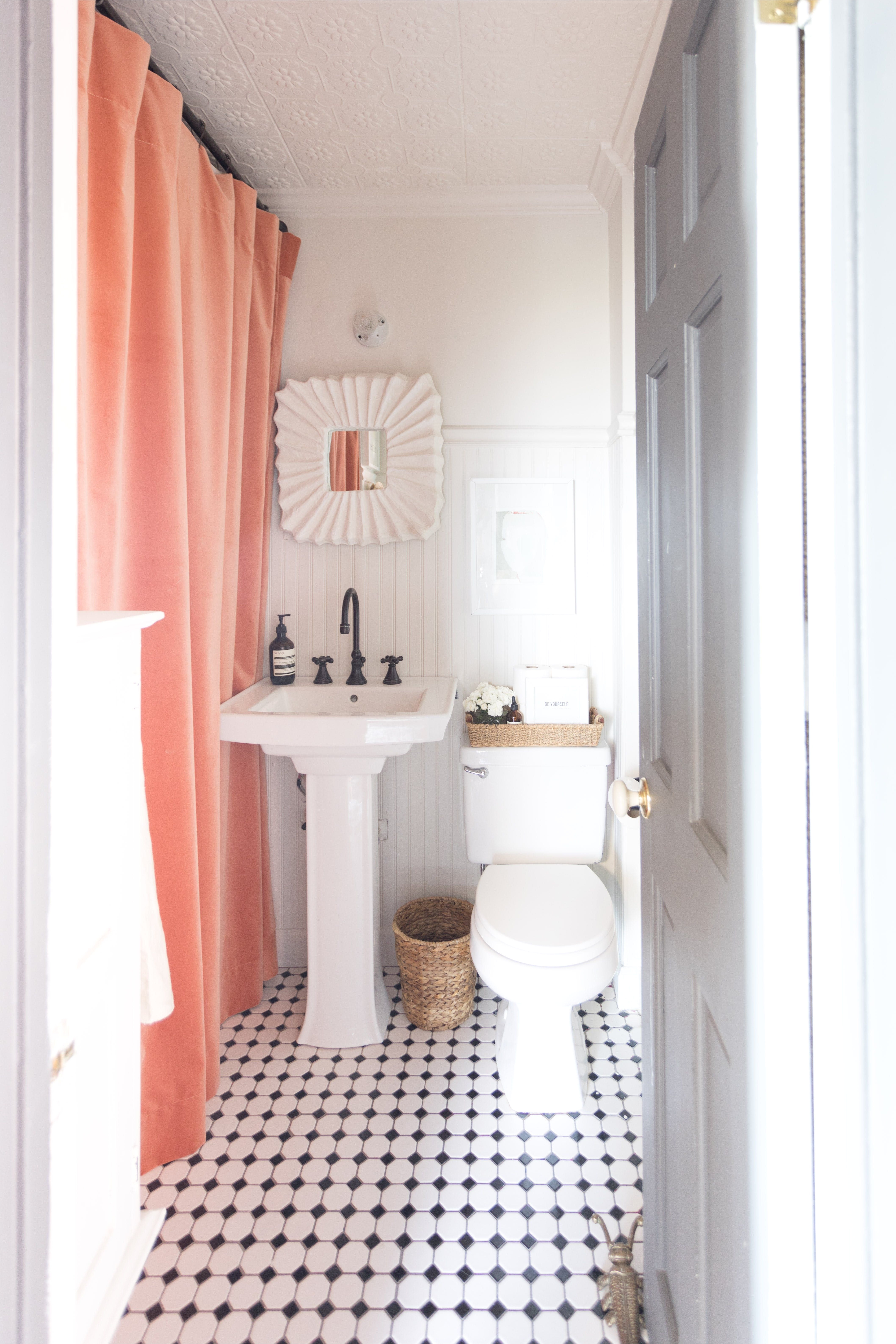 the bathroom is painted in benjamin moore sea pearl the mirror above the sink is from